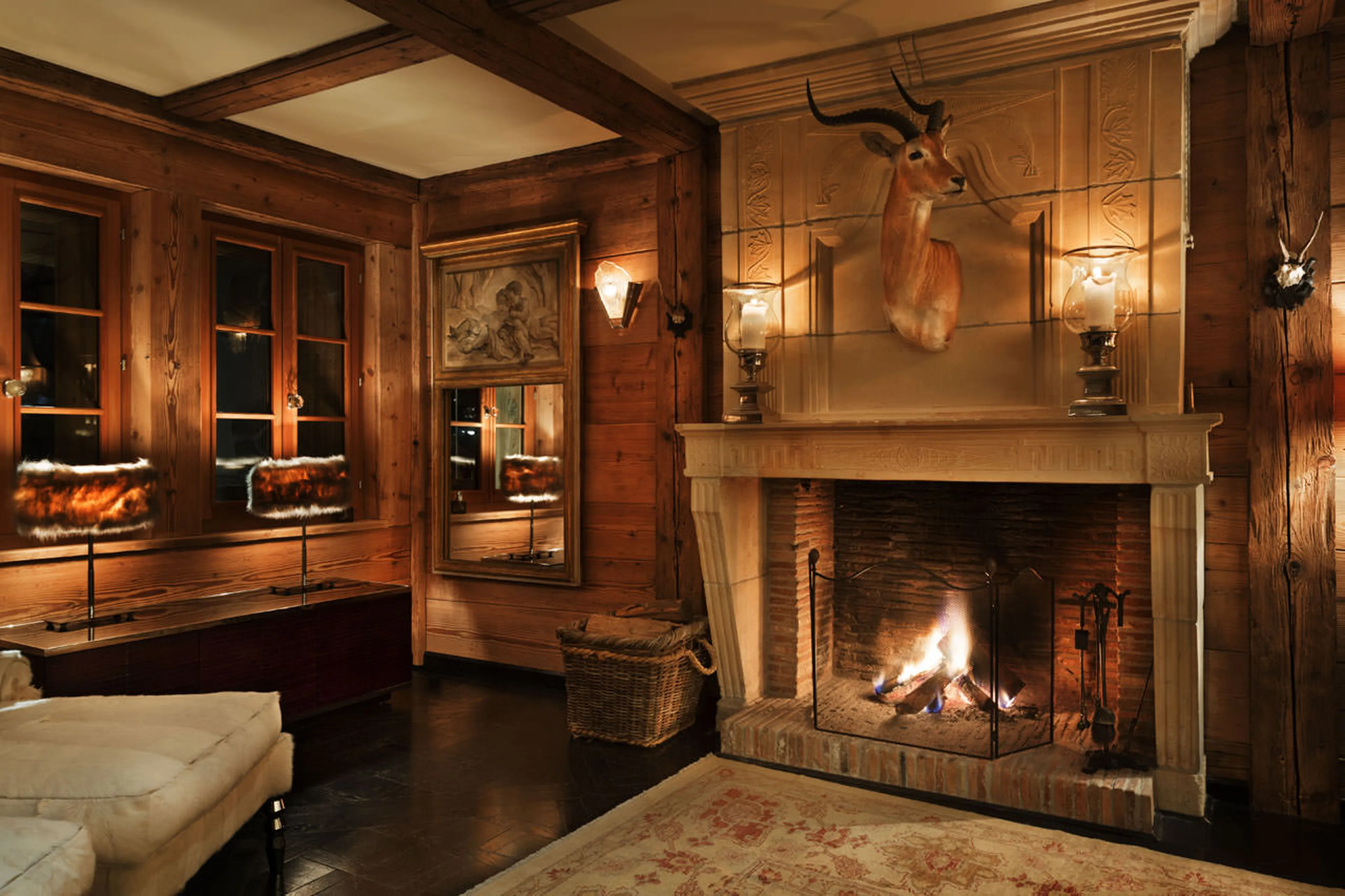 Open fireplace in living room of Chalet Truffe Blanche in Verbier
