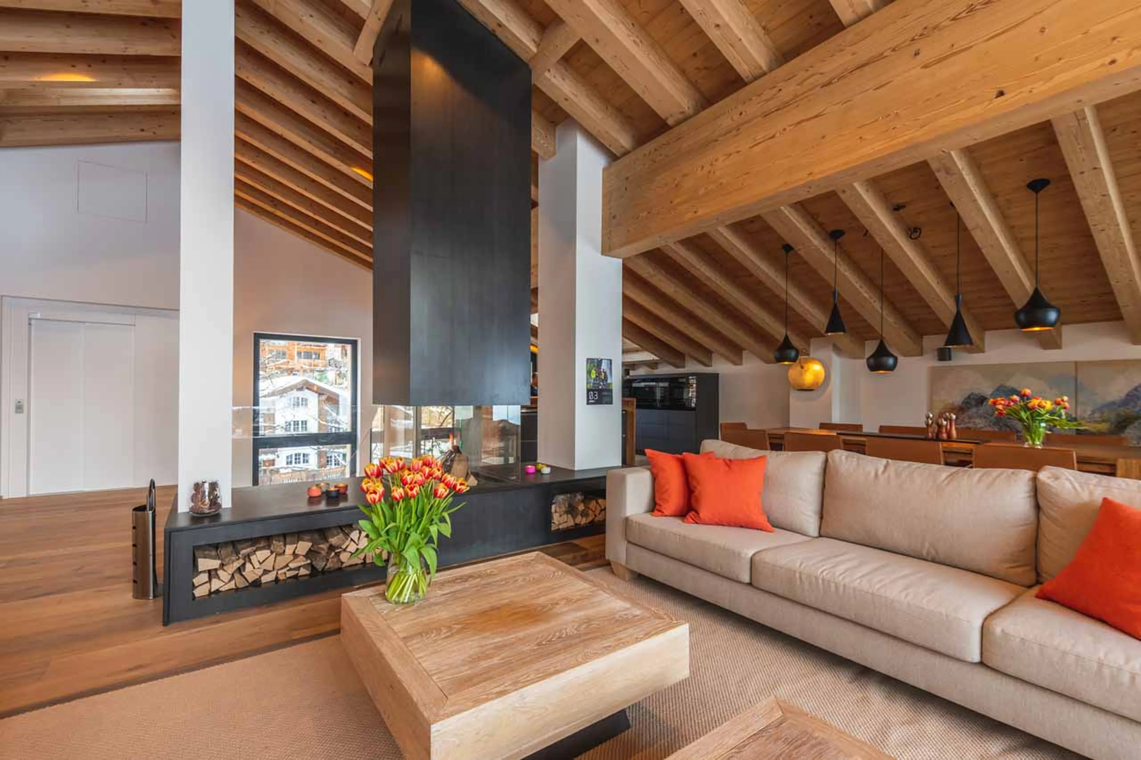 Fireplace and sofa in living area at Chalet Tuftra in Findelbach