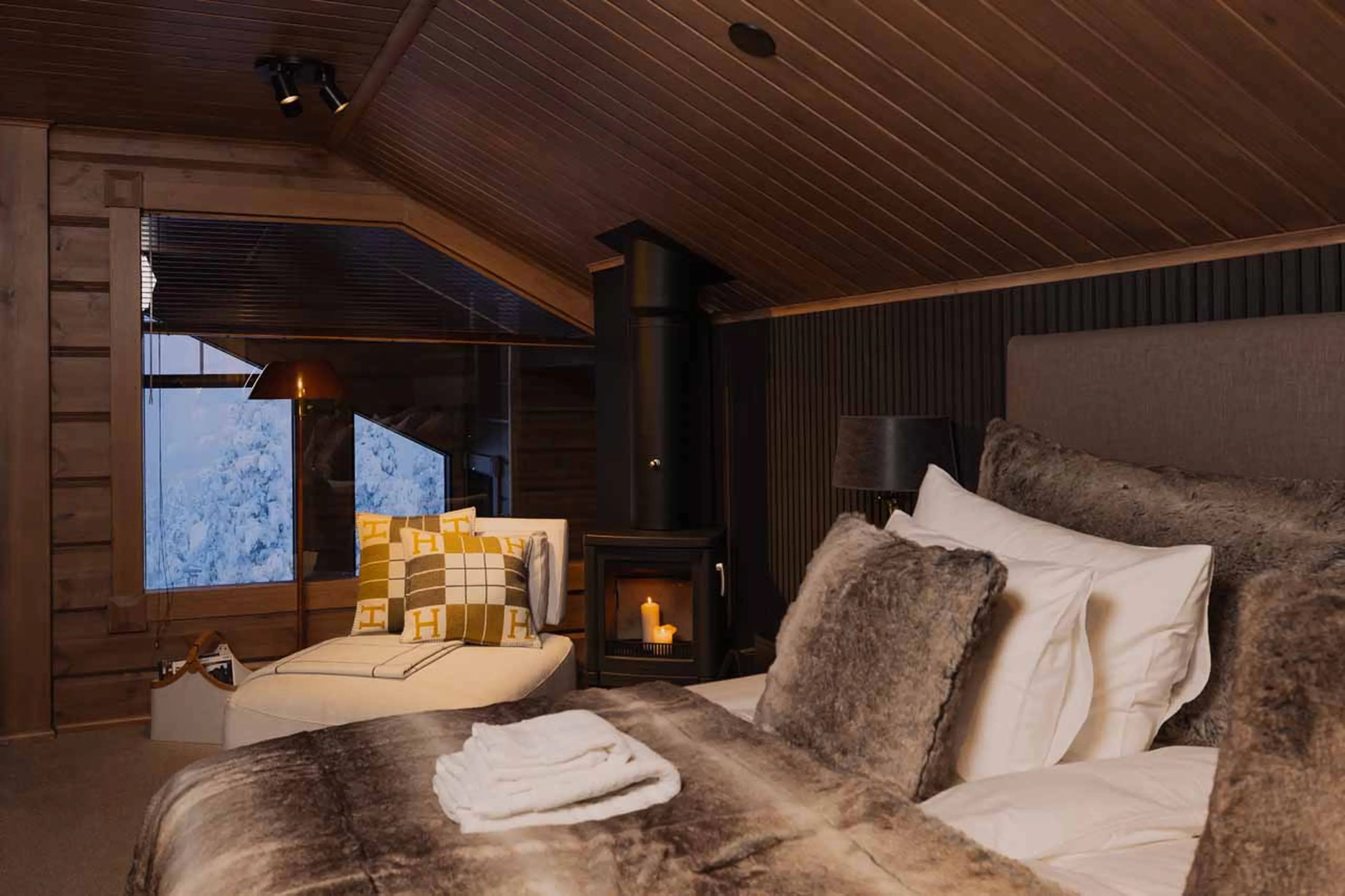 Wood burner in master suite at Chalet Utsu in Levi, Finland