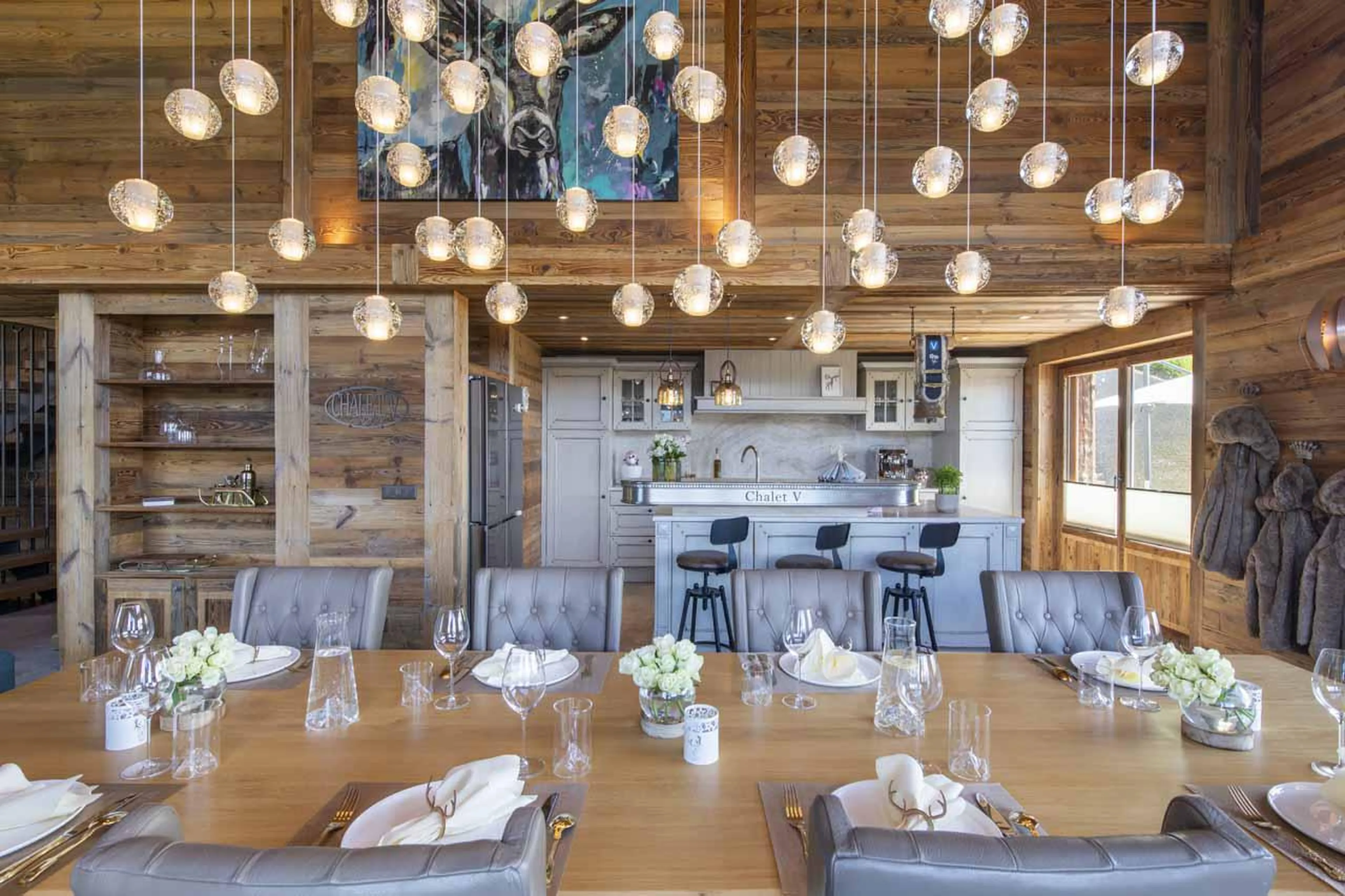 Open kitchen with breakfast bar at Chalet V in La Tzoumaz