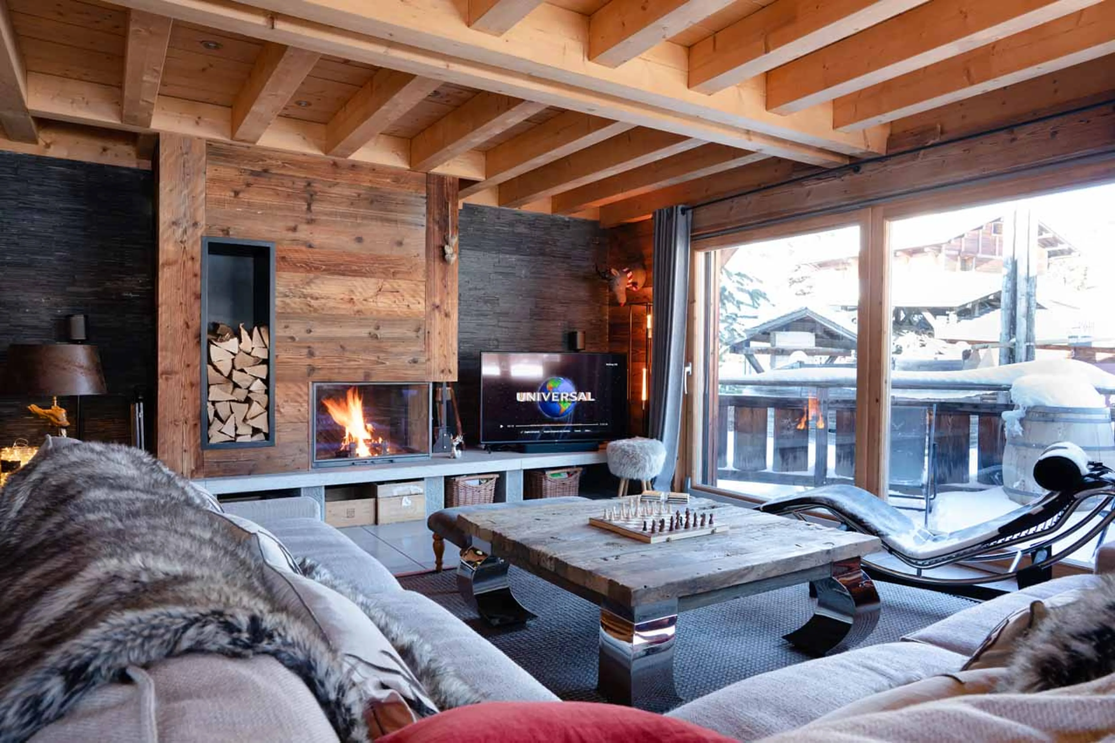 Fireplace and TV in living area of Chalet Valambrun in Les Gets