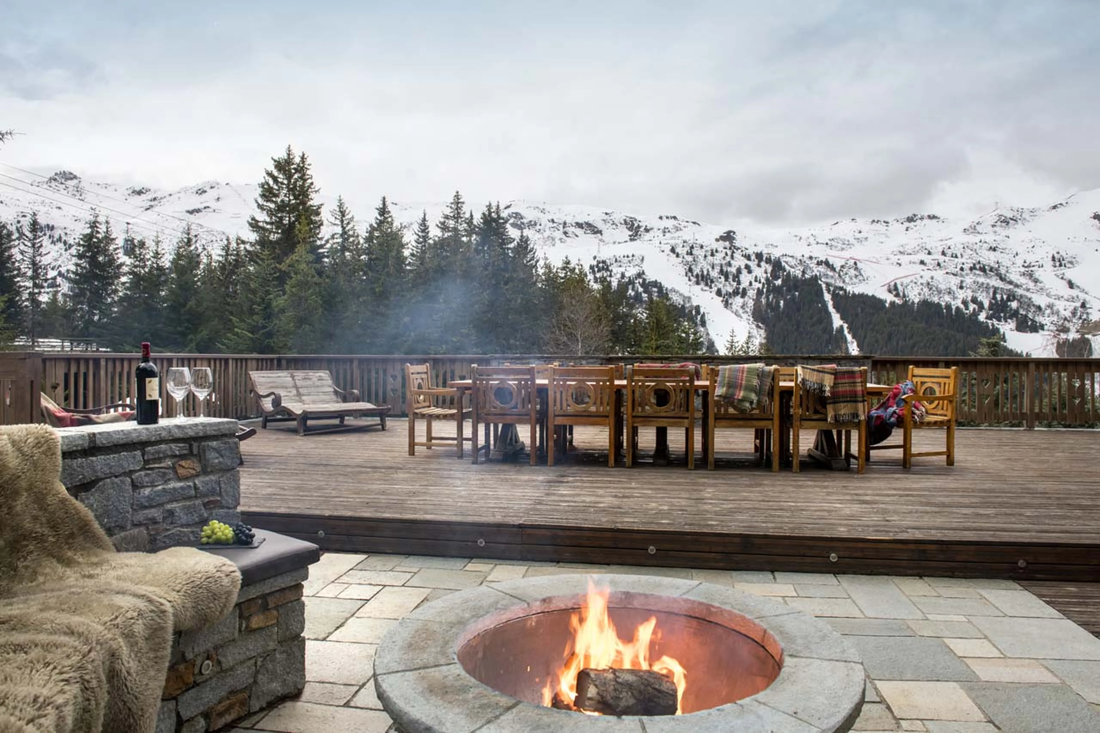 Terrace with firepit atChalet Valentine in Meribel