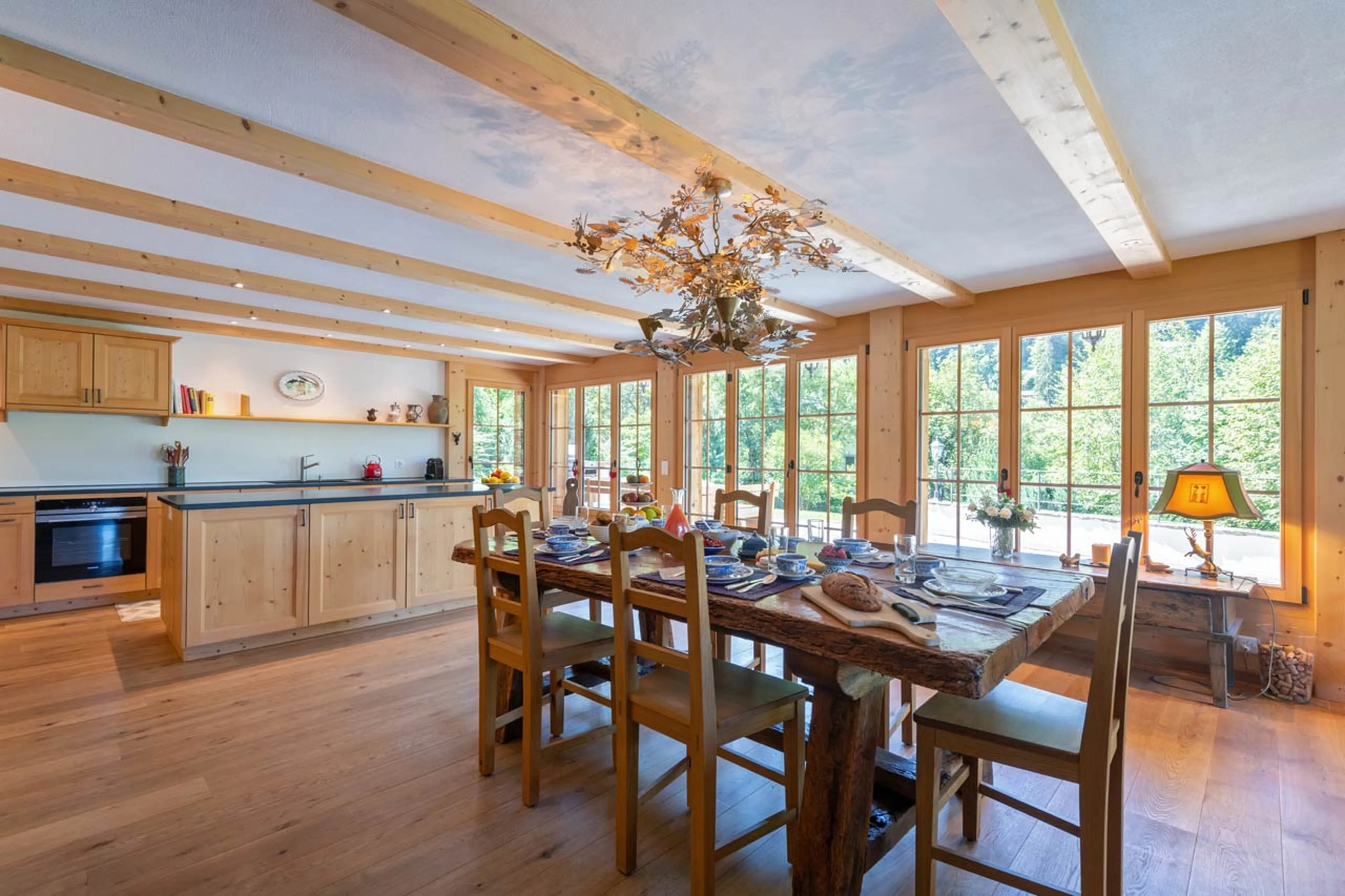 Dining area and kitchen at Chalet Verbena in Klosters