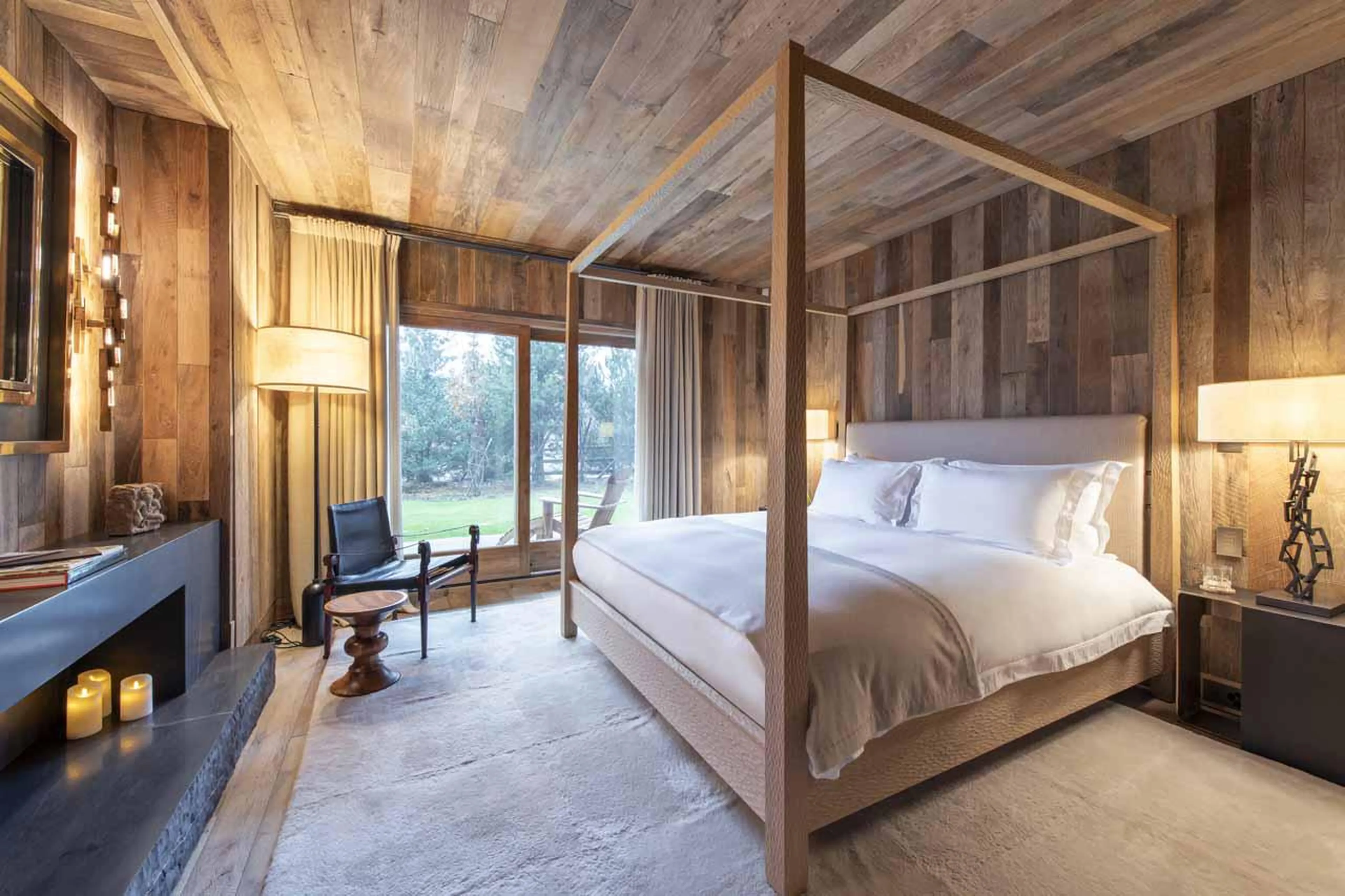 Ground floor double bedroom with terrace access and en-suite shower room at Chalet Vicuna in Verbier