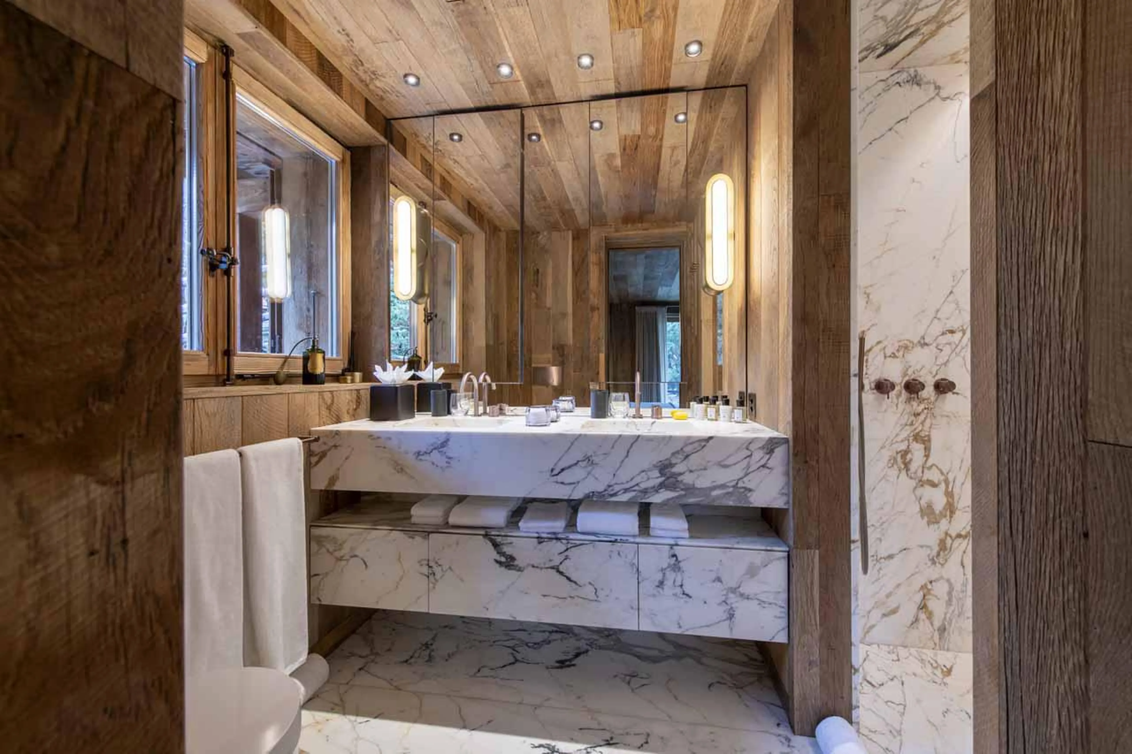 En-suite shower room with double basin at Chalet Vicuna in Verbier