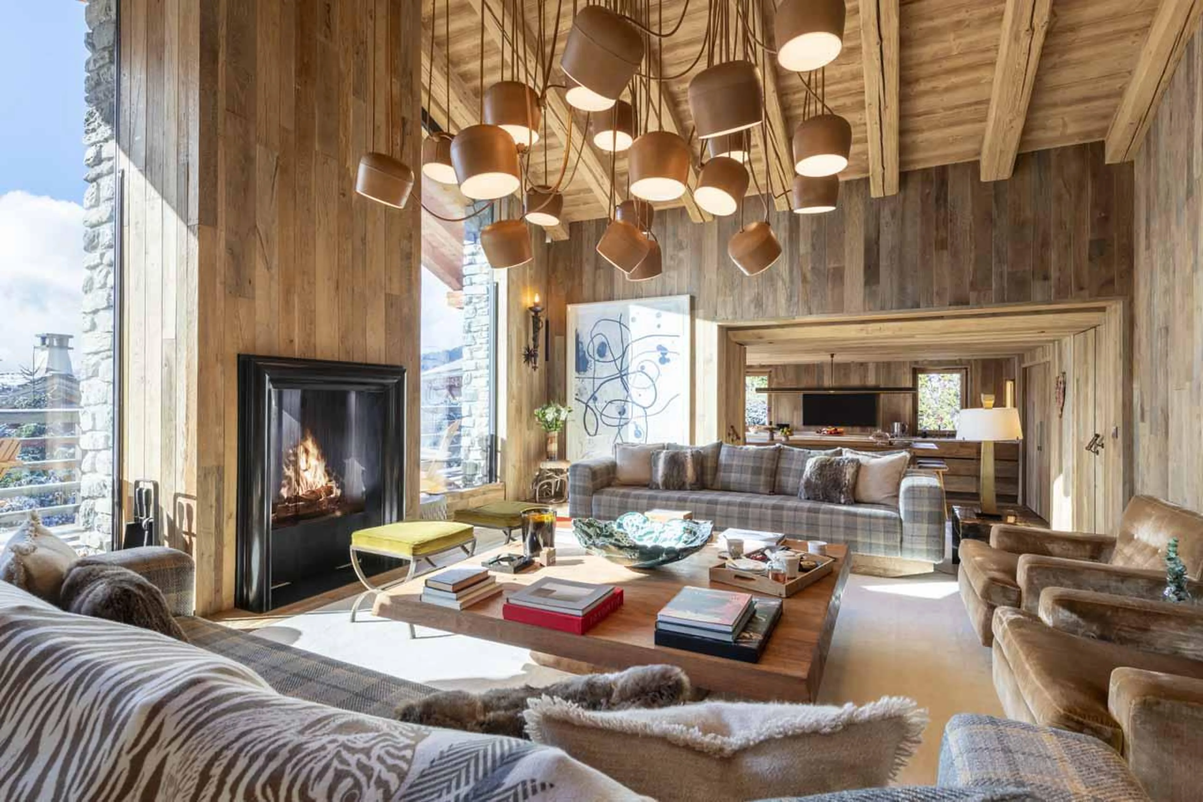 Sofa area with avant-garde abstract chandelier at Chalet Vicuna in Verbier