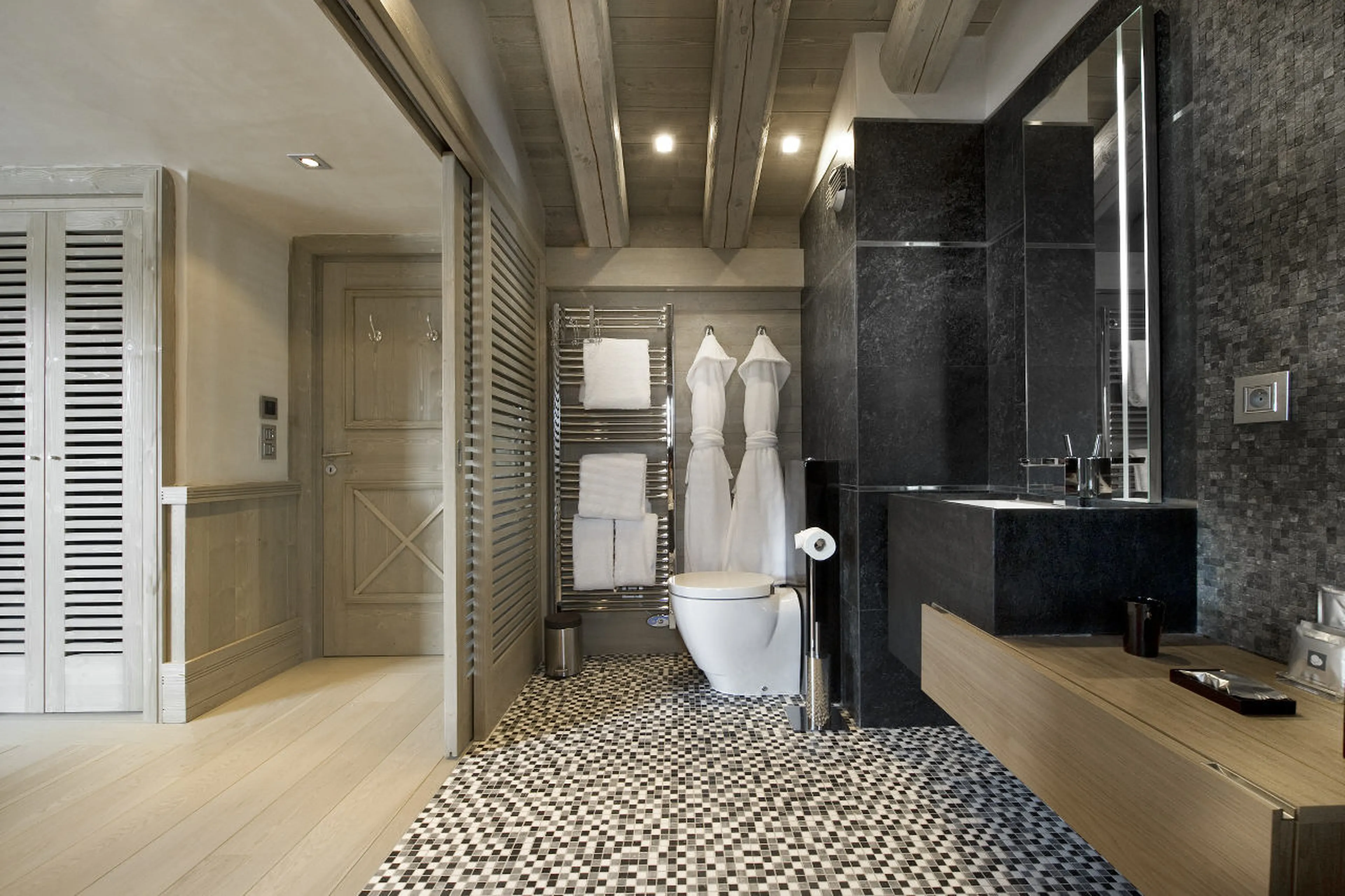 En-suite bathroom with bathrobes in Chalet White Pearl, Val d’Isere