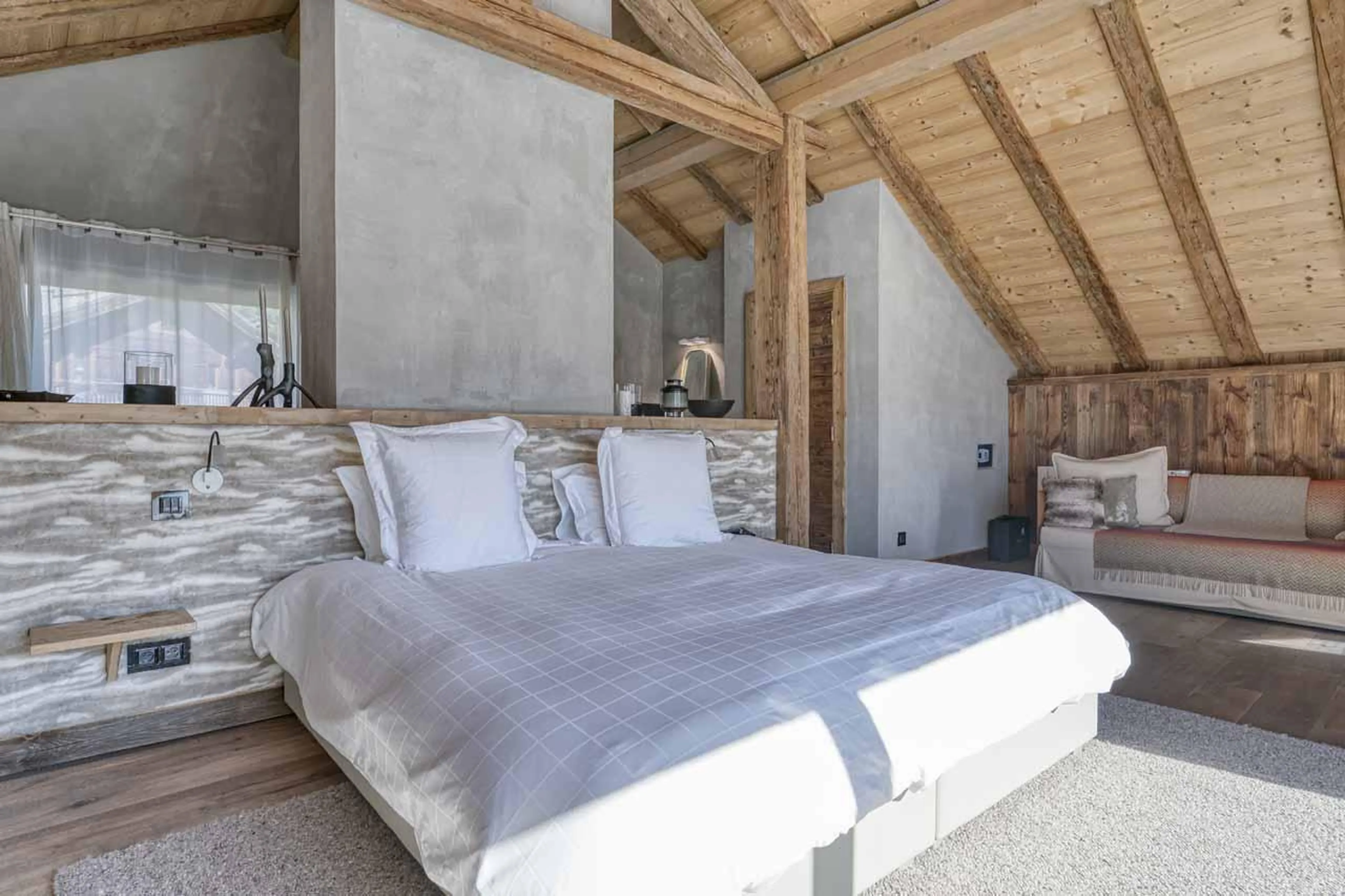 Double bed in master suite at Chalet Yeti in Megeve