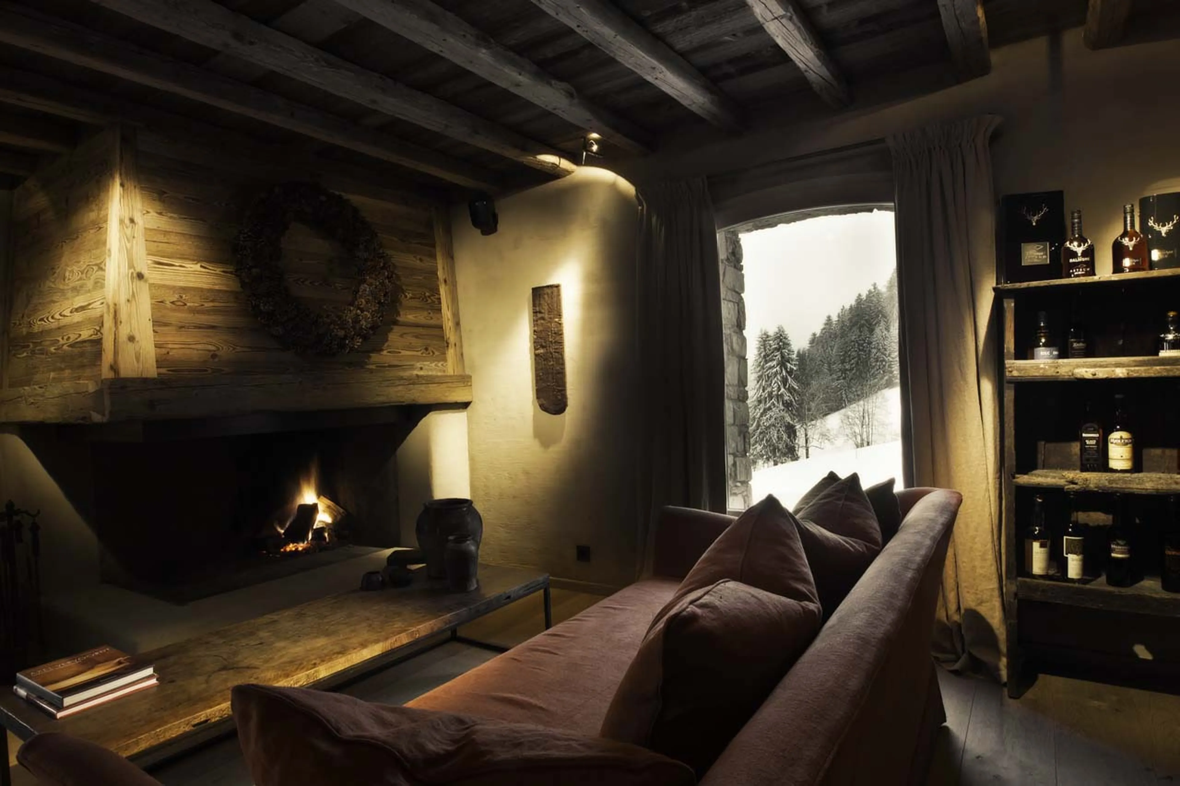 Fireplace in lounge bar at Le Chalet Zannier in Megeve