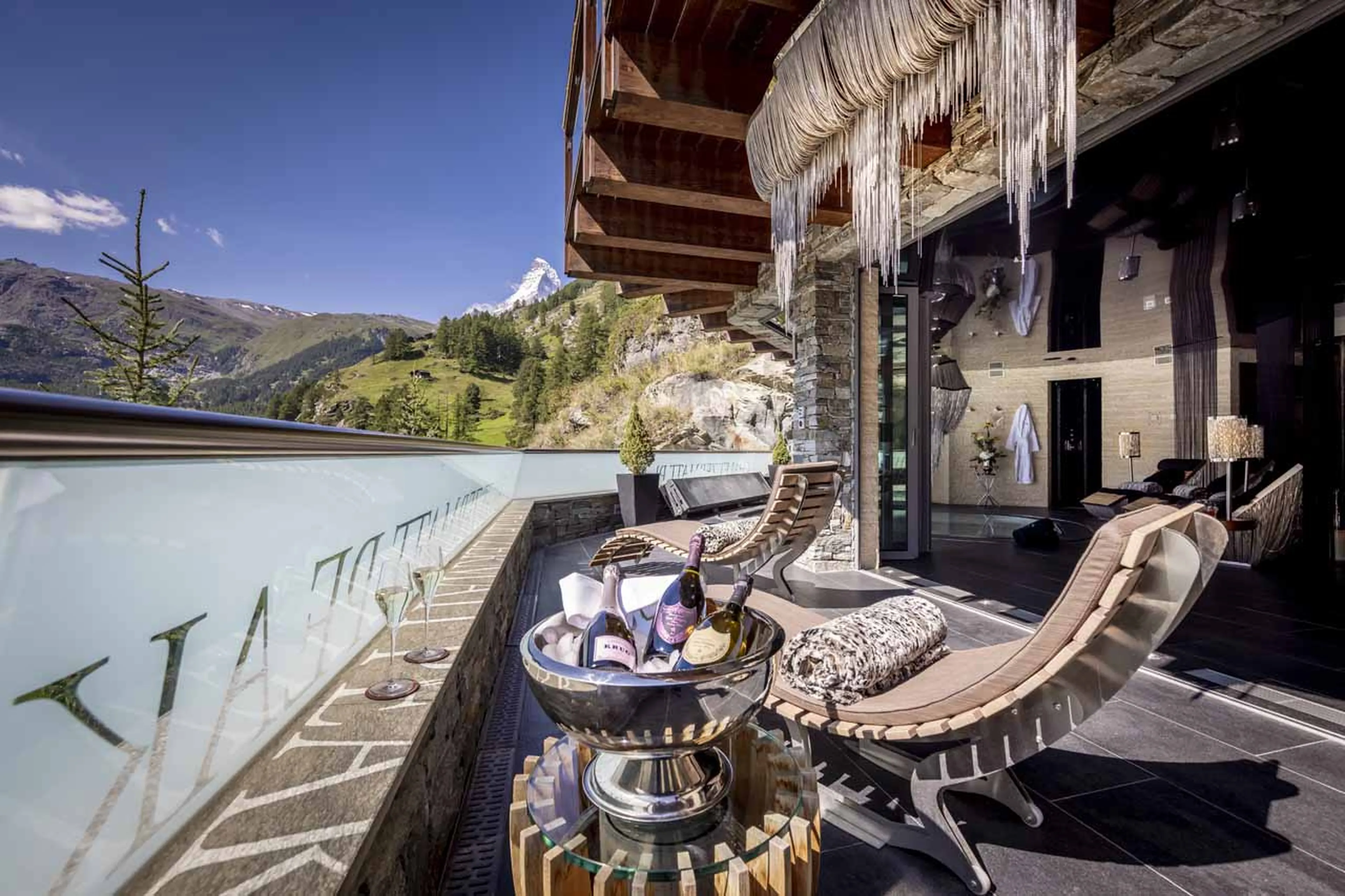 Afternoon tea on terrace of Chalet Zermatt Peak in summer