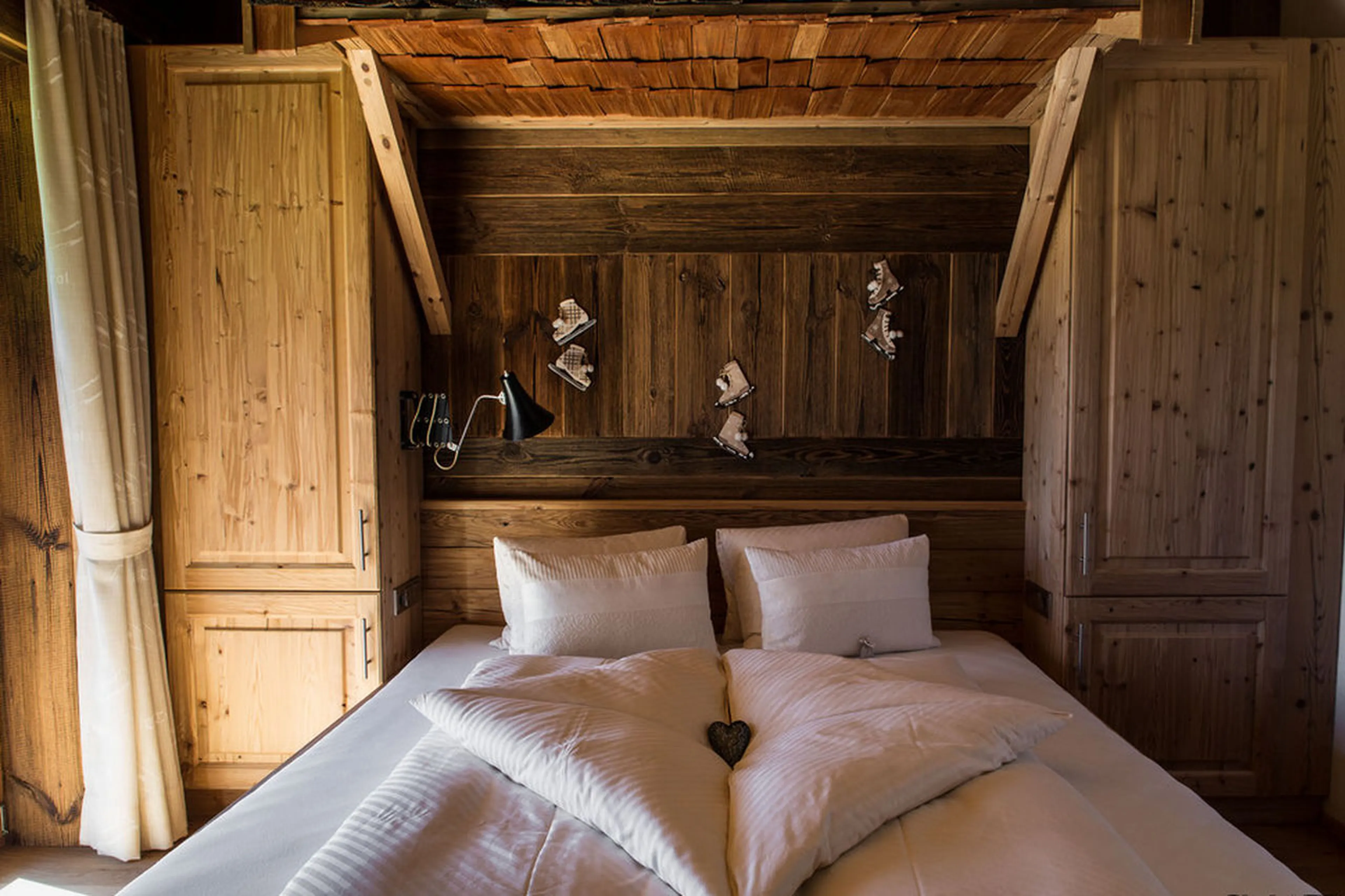 Bedroom with double bed, private balcony and shared bathroom in Chalet Ziller in Zillertal