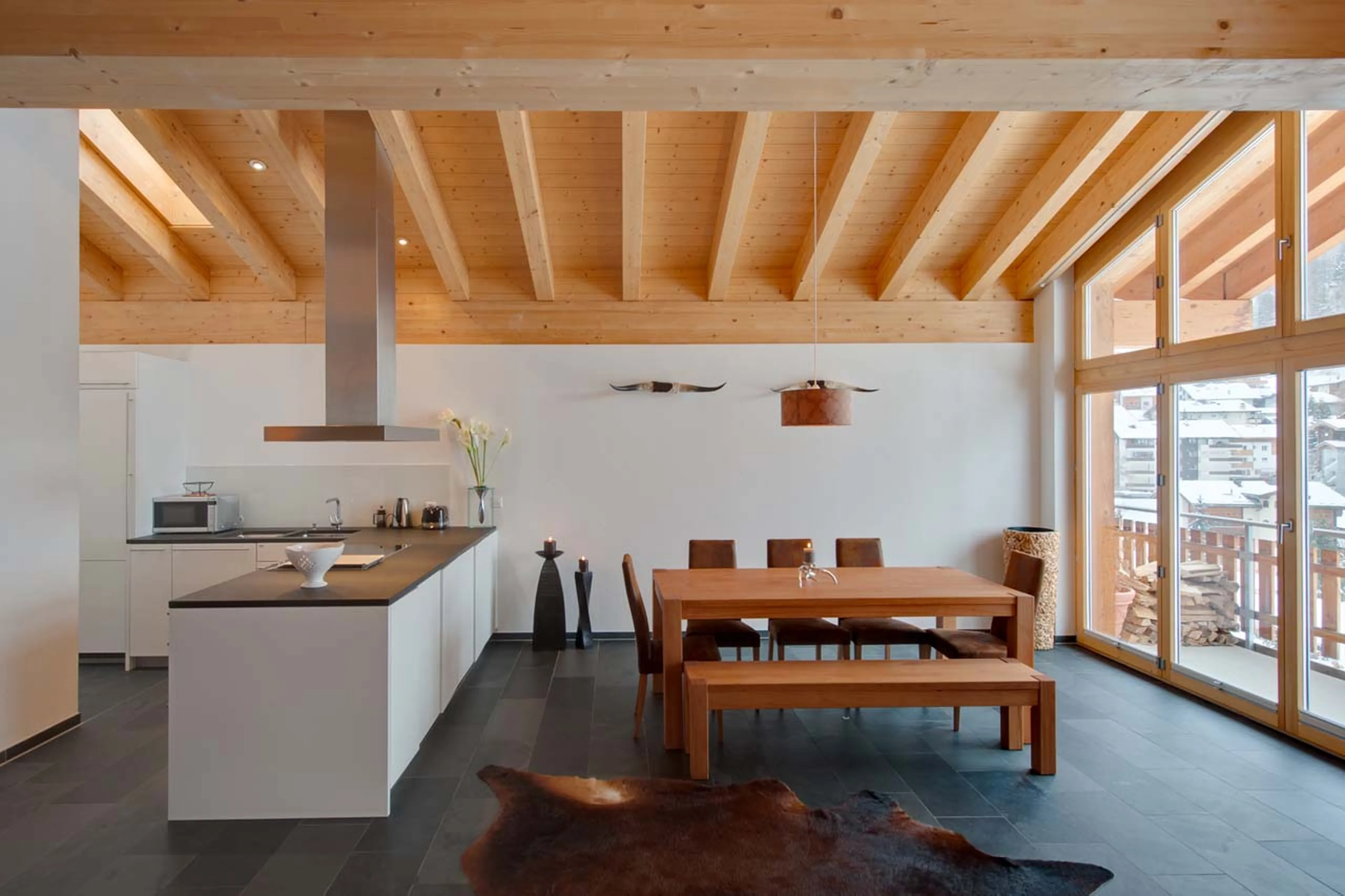 Dining room and kitchen at Chalet Zora in Zermatt