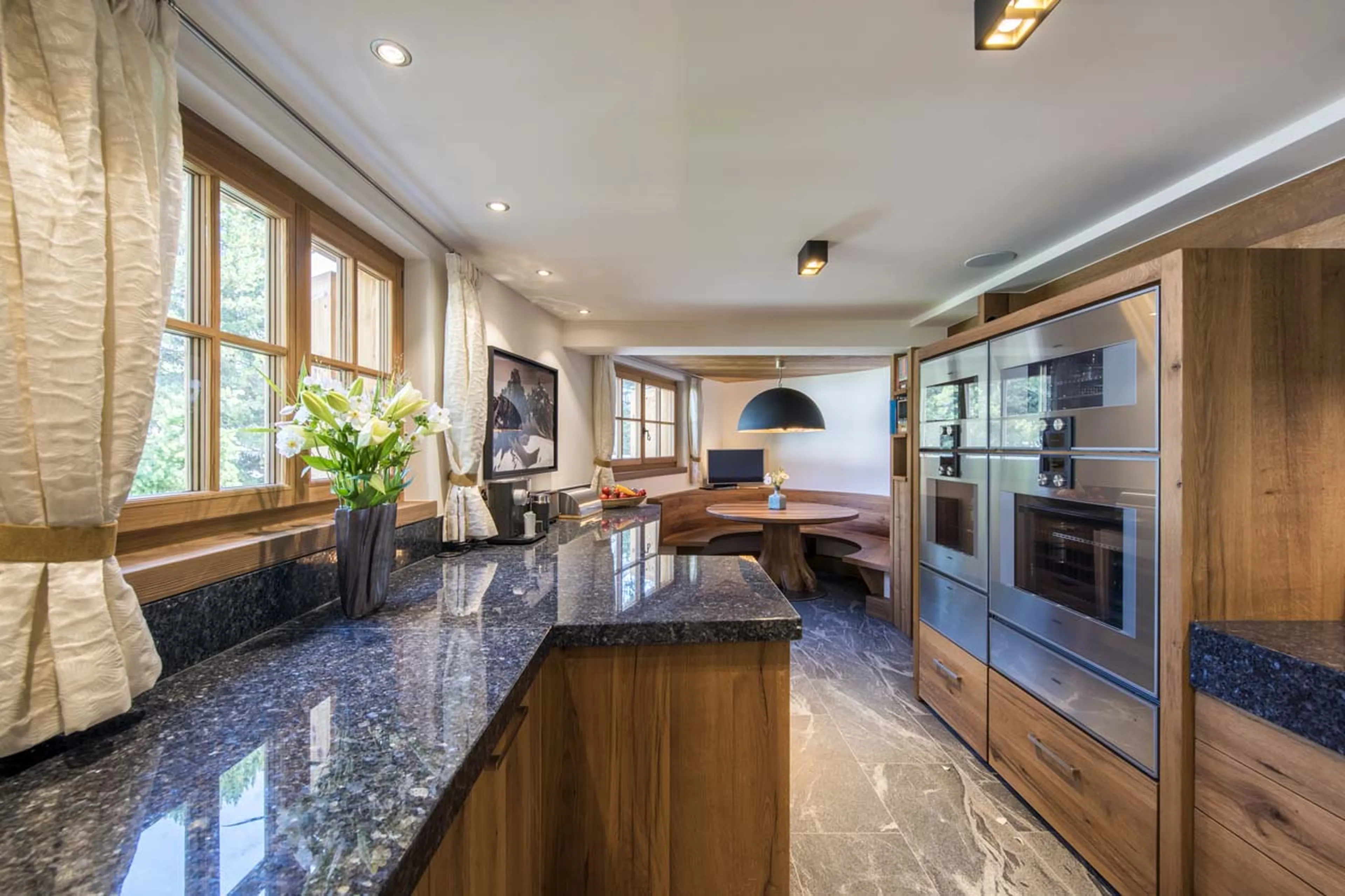 Breakfast table in family kitchen at Chesa El Toula in St Moritz