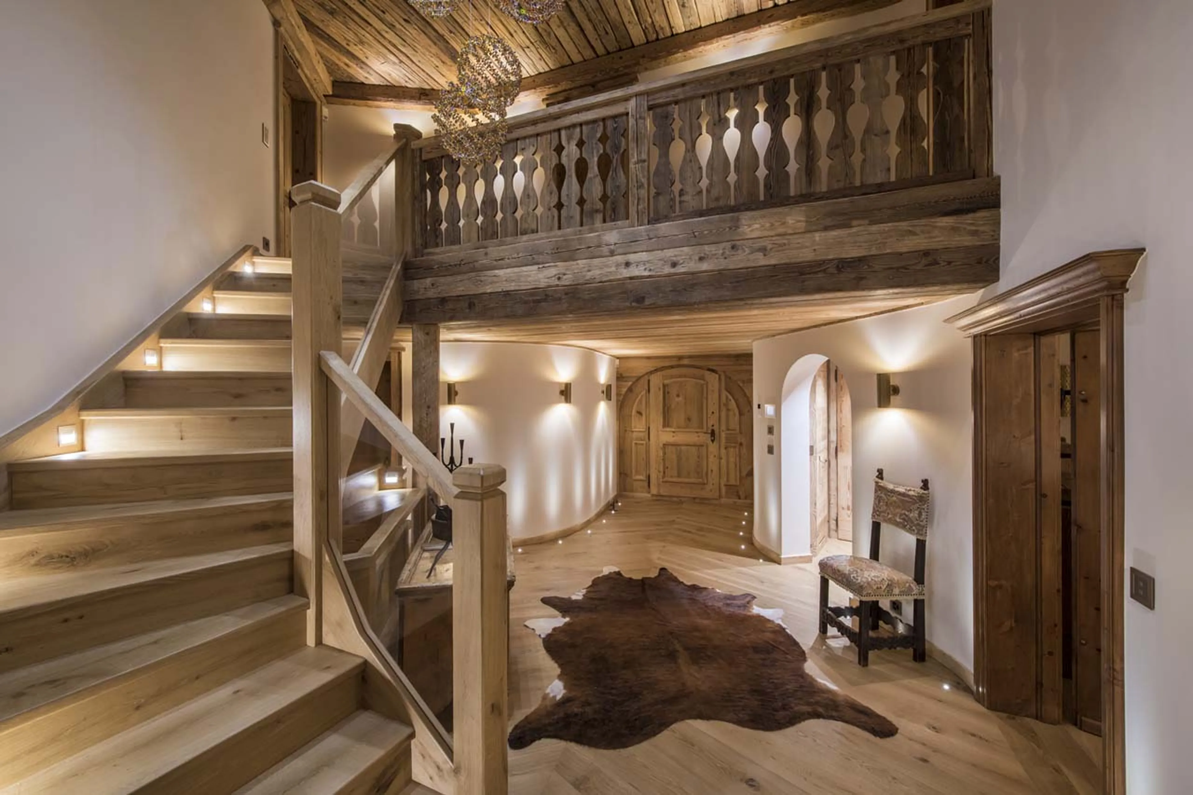 Entrance hall and staircase at Chesa El Toula in St Moritz