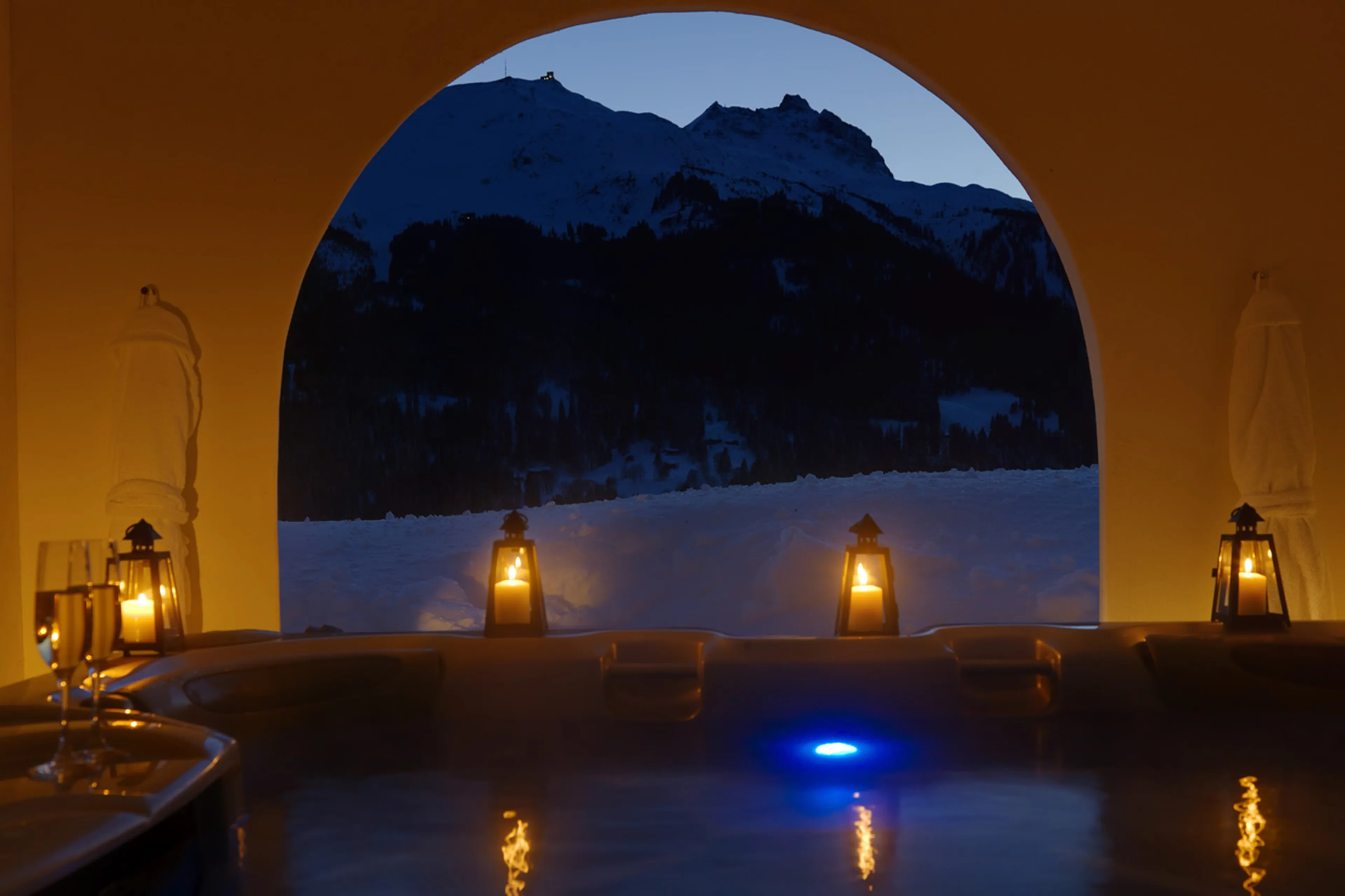 Covered hot tub at night in Chesa Falcun in Klosters