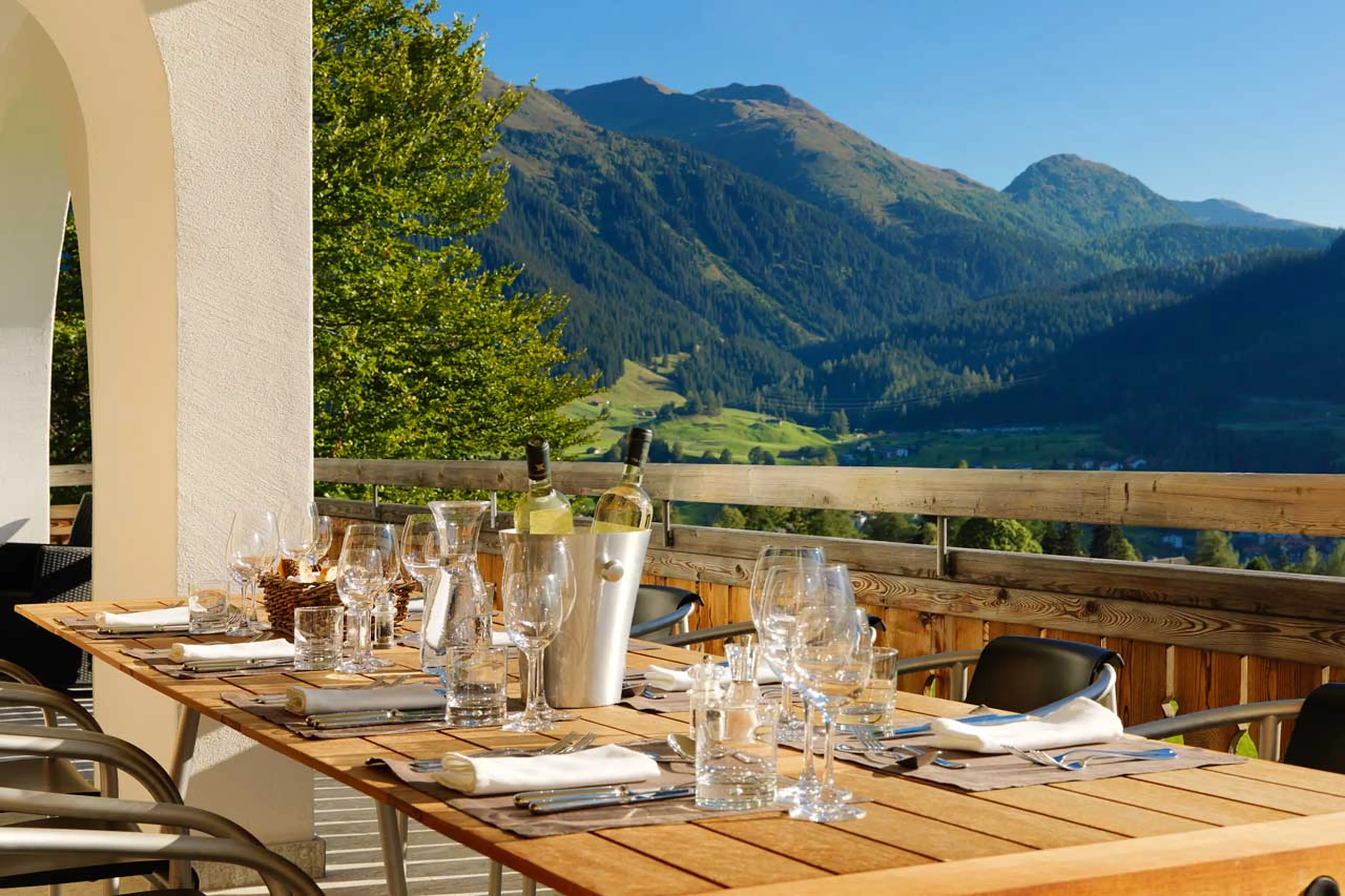 Al fresco dining on terrace at Chesa Falcun in Klosters