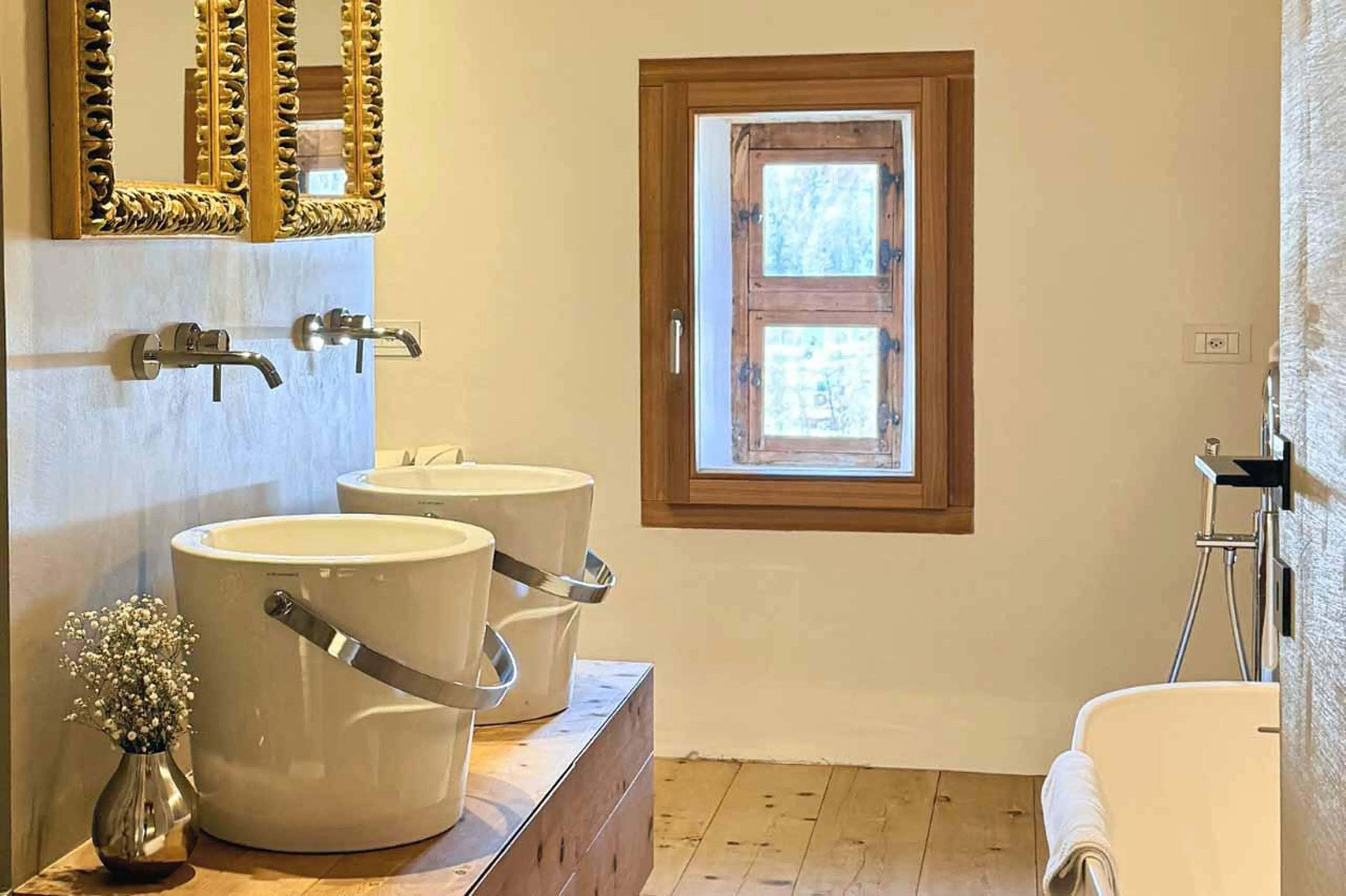 Bathroom with double basin at Chesa Laret in St Moritz