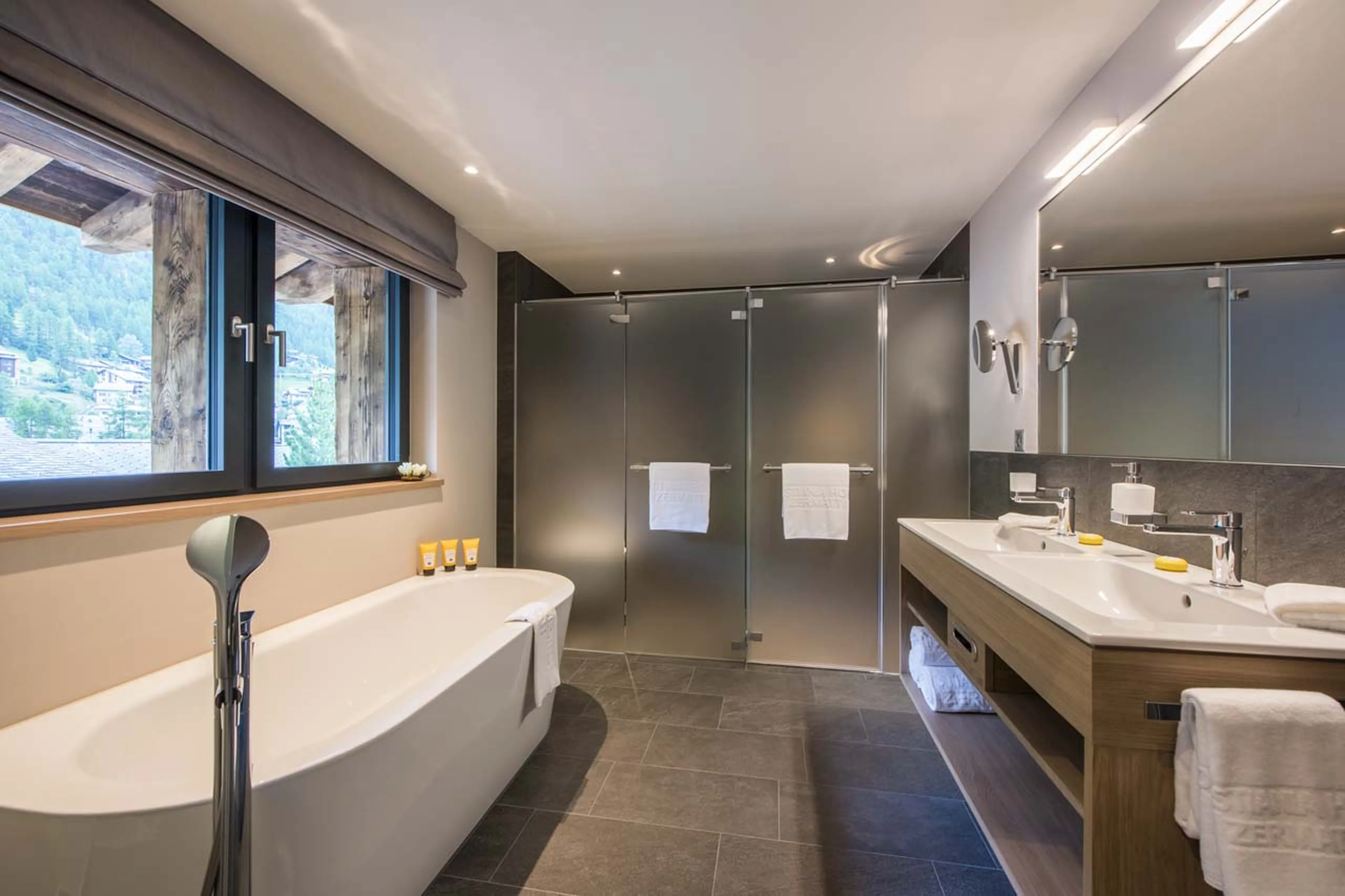 Bath tub in en-suite bathroom at Christiania Penthouse in Zermatt