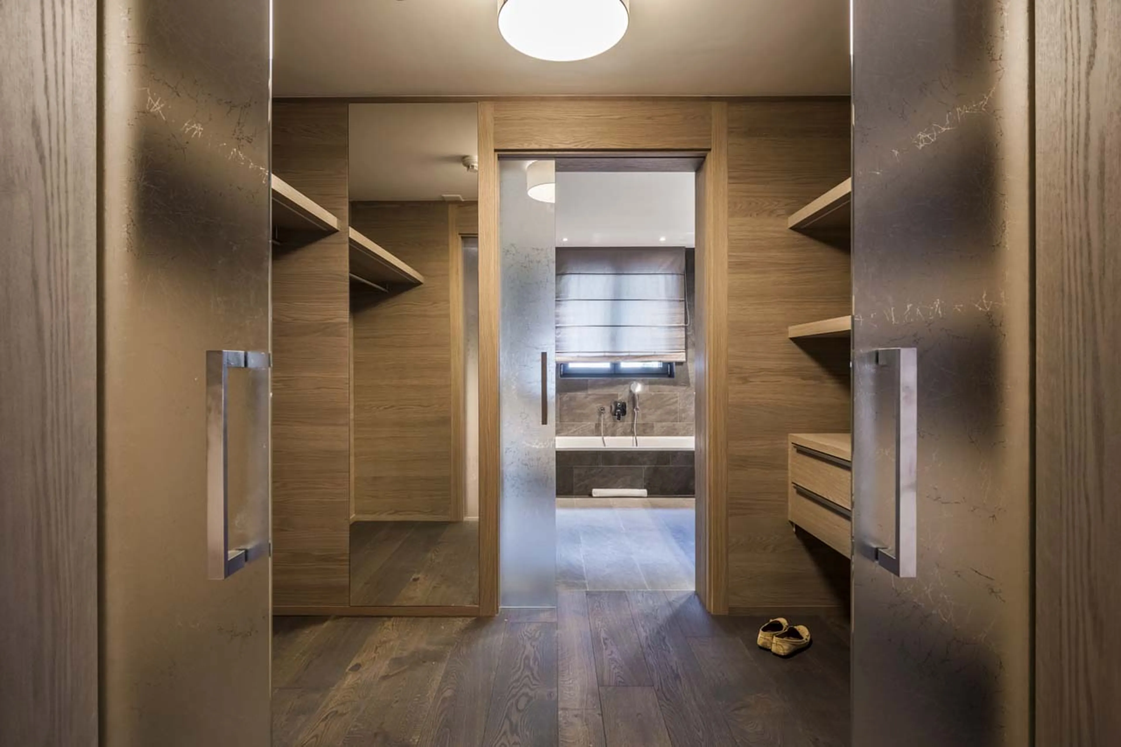 Walk-in wardrobe of bedroom six in Christiania Penthouse in Zermatt