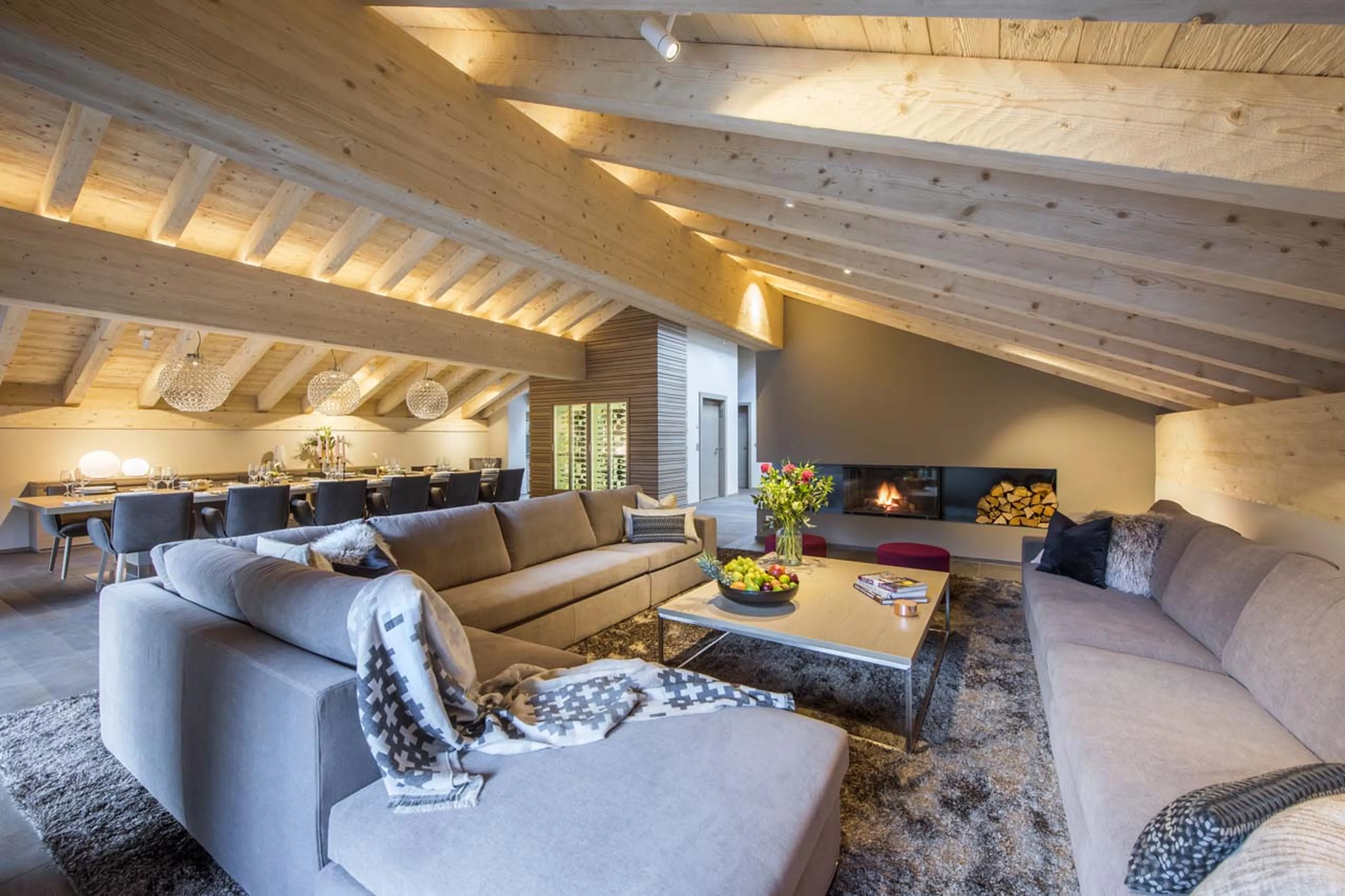 Wood burning fireplace in living area of Christiania Penthouse in Zermatt