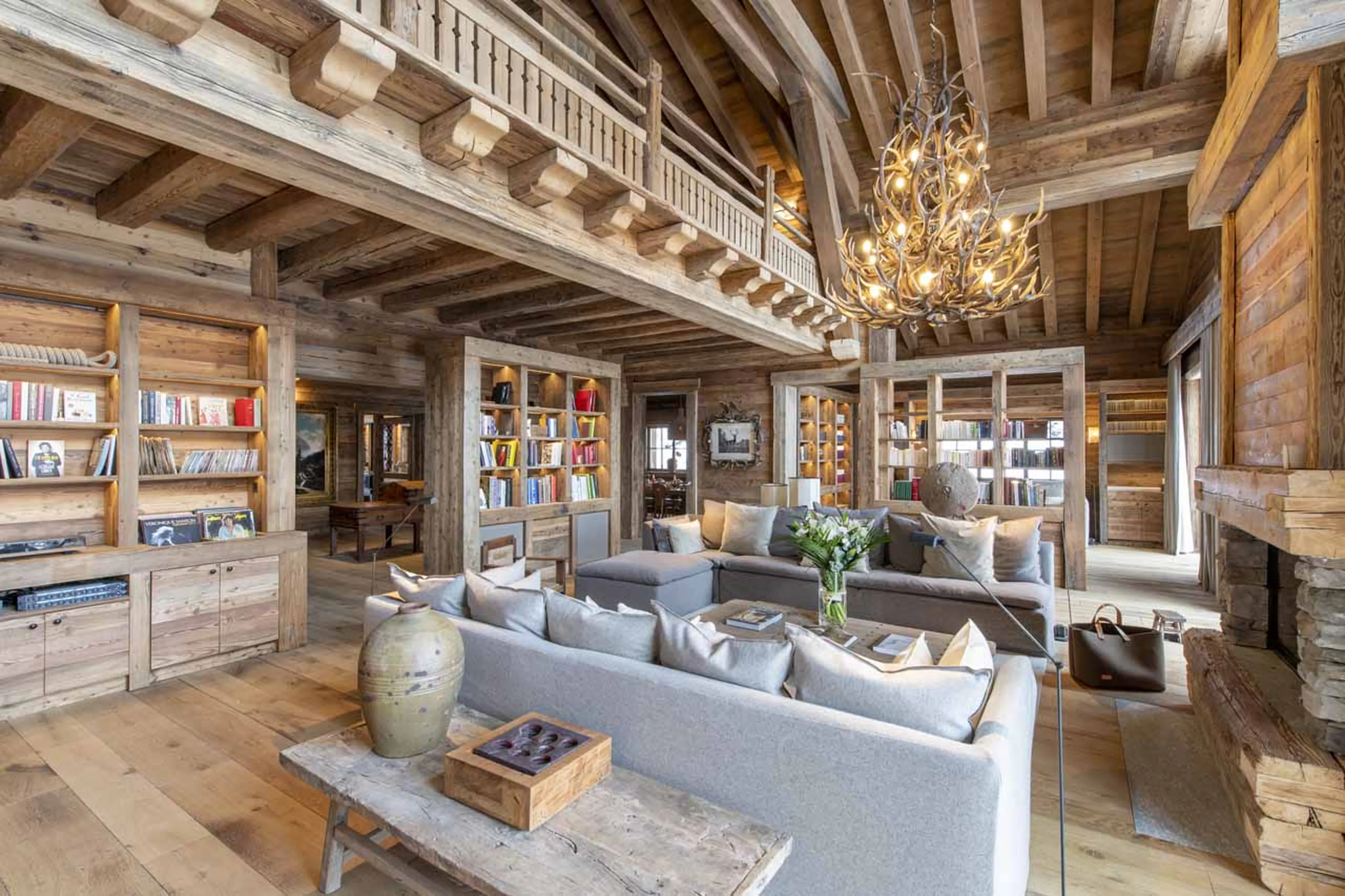 Bookshelves line the walls of Chalet Domaine de l'Orme in Meribel