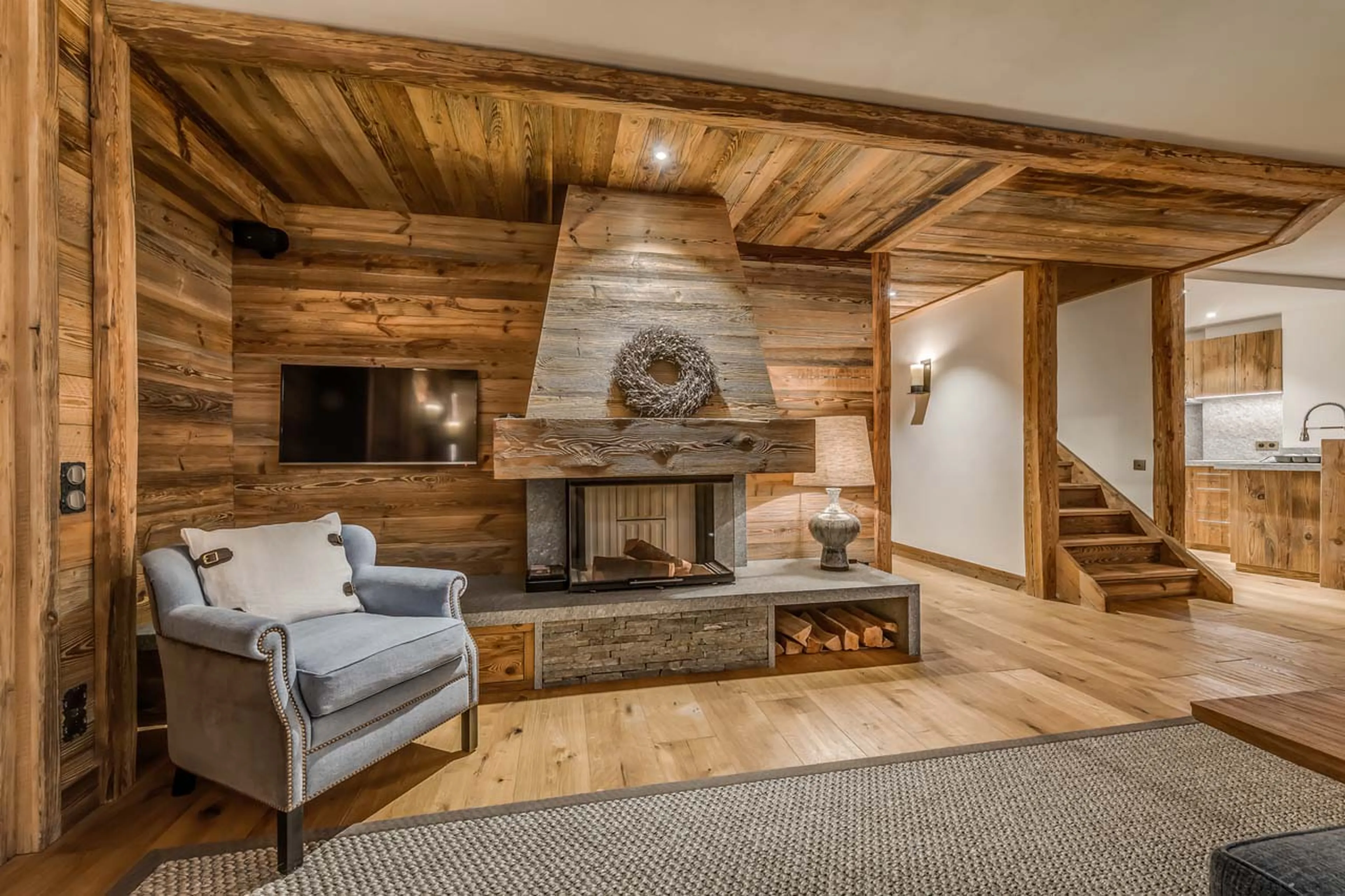 Fireplace and TV in living area of Etoile Filante in Val d'Isere
