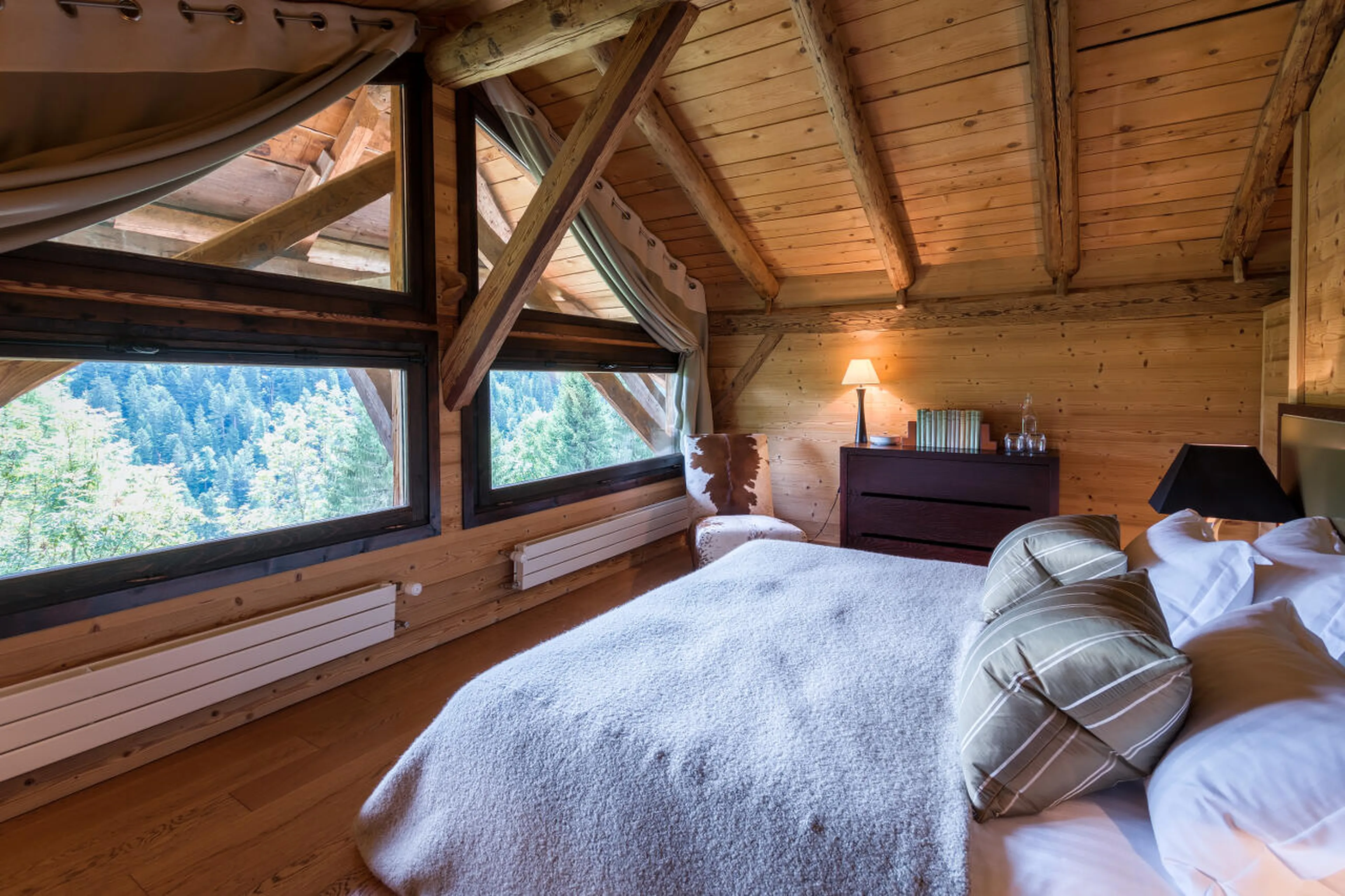 Master bedroom with super-king/twin beds and mountain views in Ferme de Moudon in Les Gets
