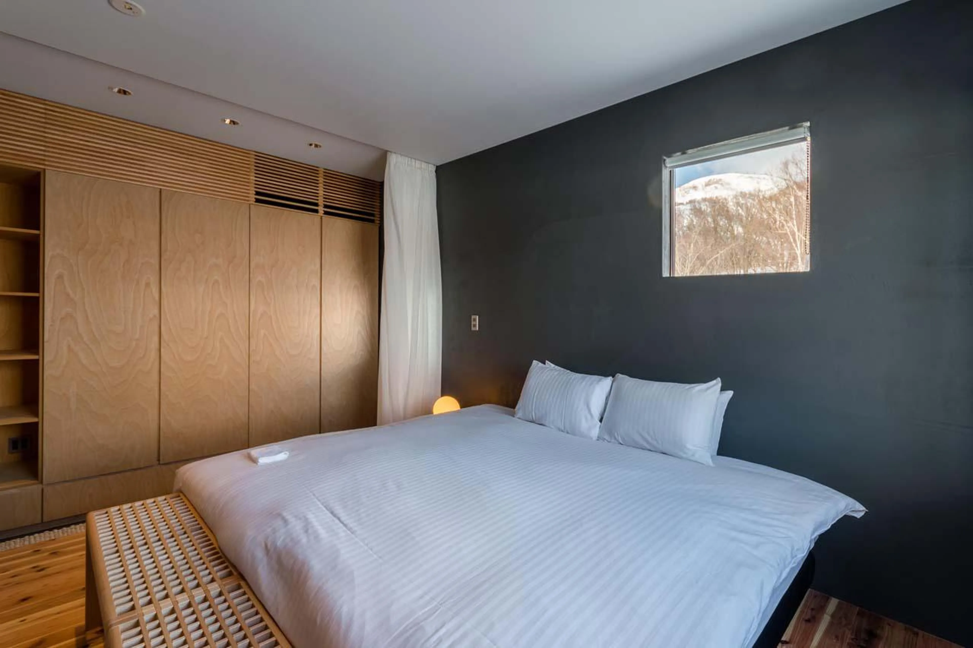 Bedroom with neutral tones at Chalet Foxwood E in Niseko