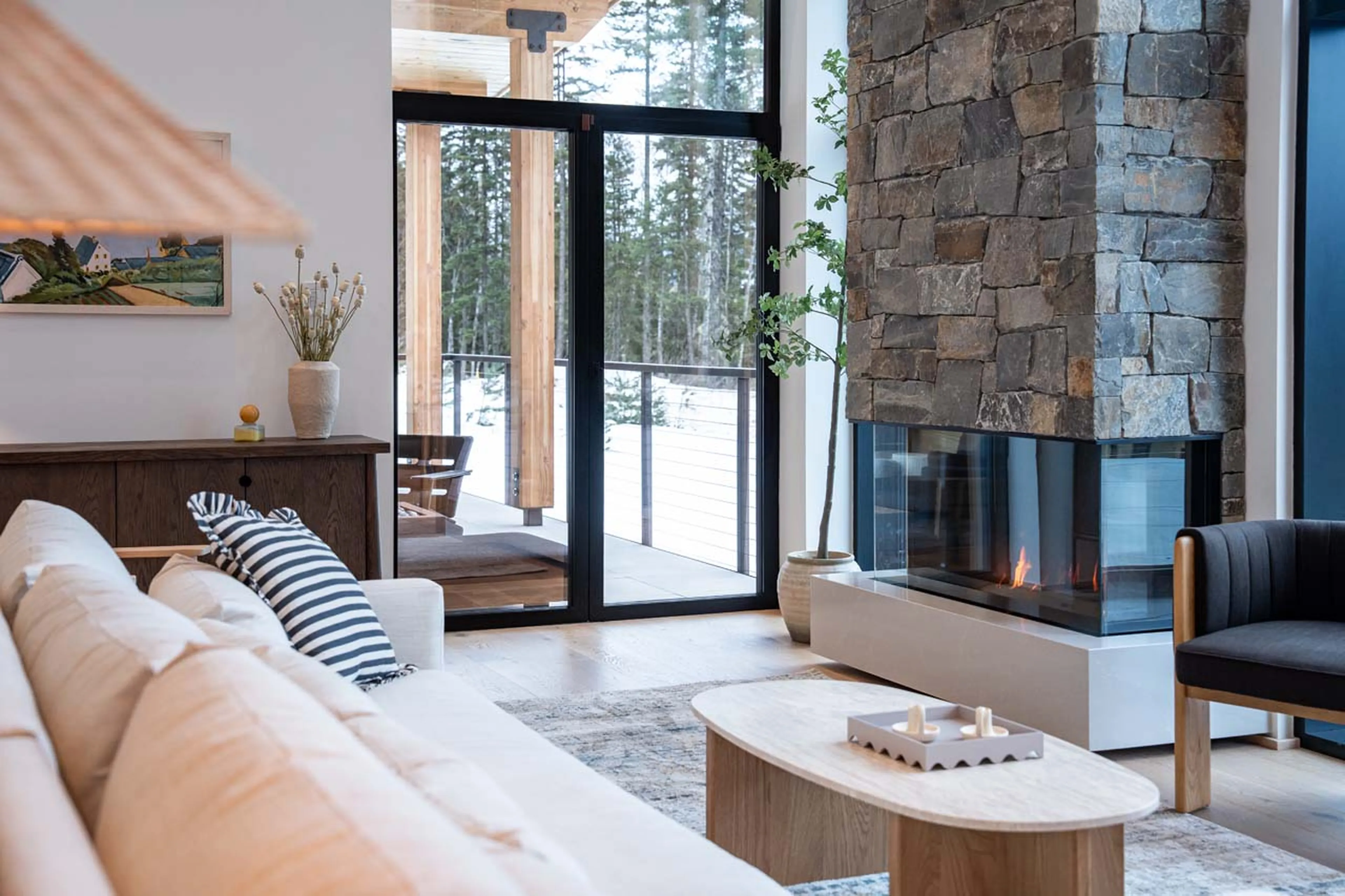 Sitting room with fireplace in Ghost Peak Chalet, Revelstoke