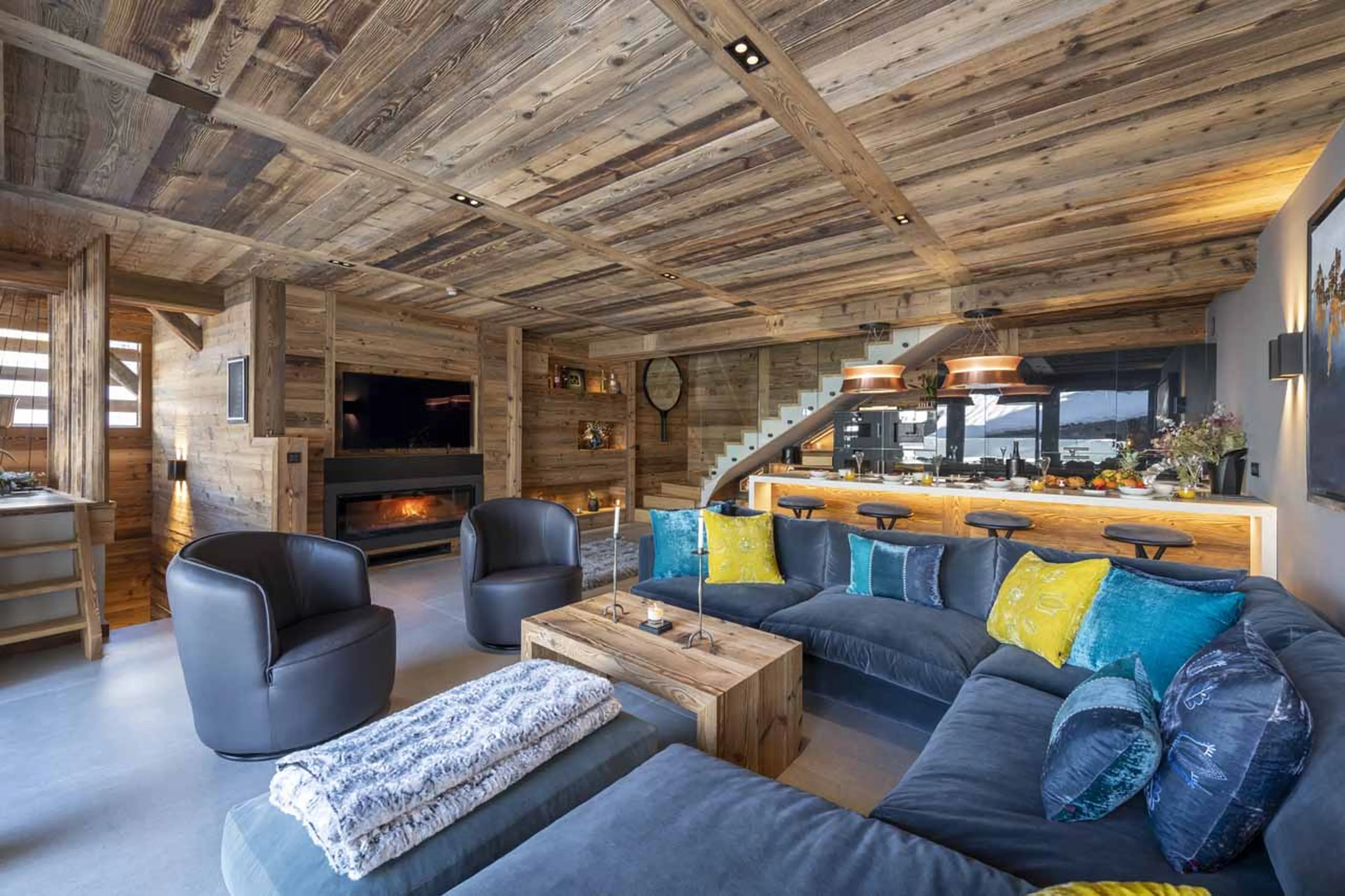 Living area with fireplace at Grande Maison in Morzine