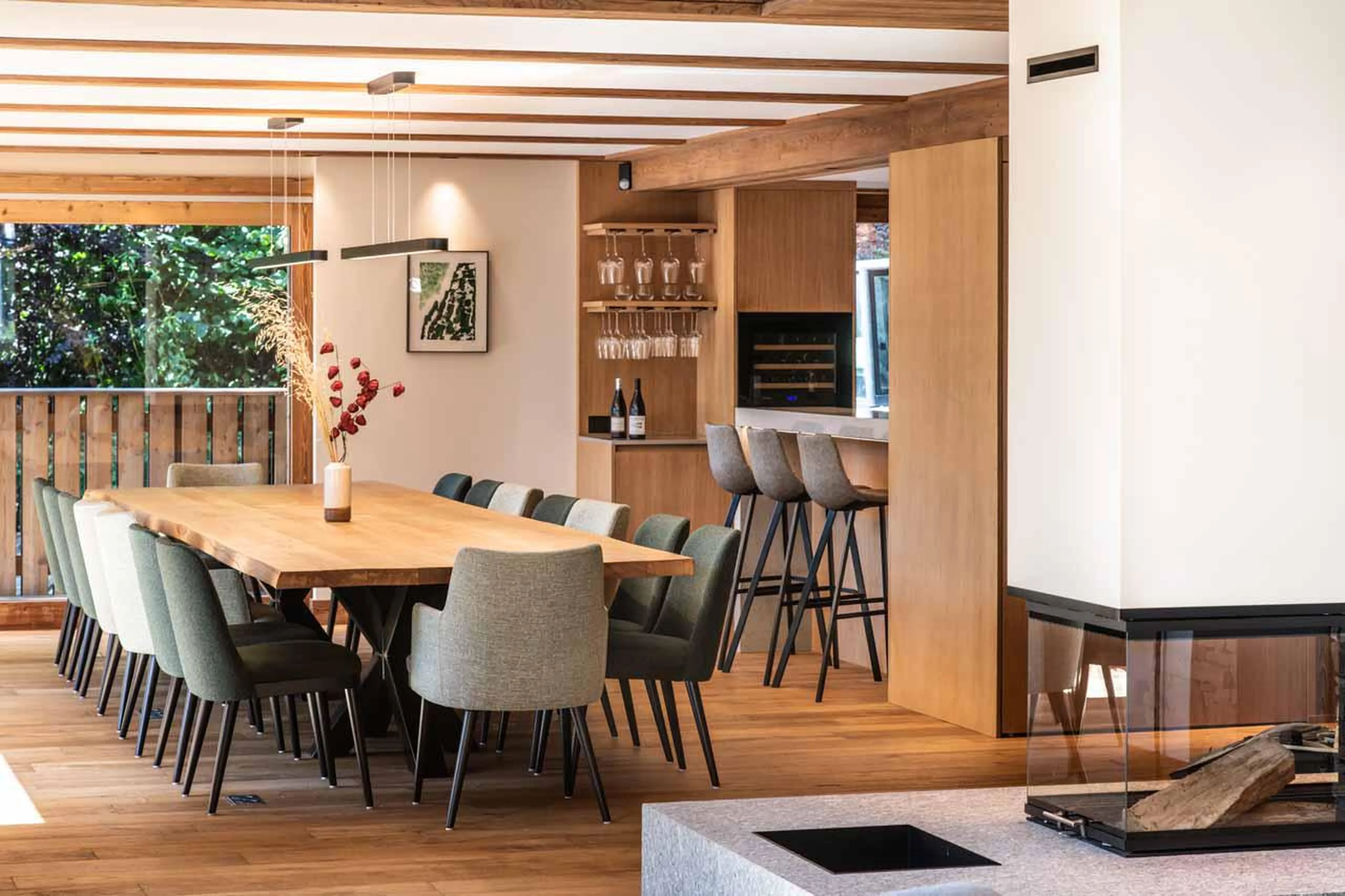 Wood-burning fireplace central within the space at Granite Mountain Lodge in Chamonix