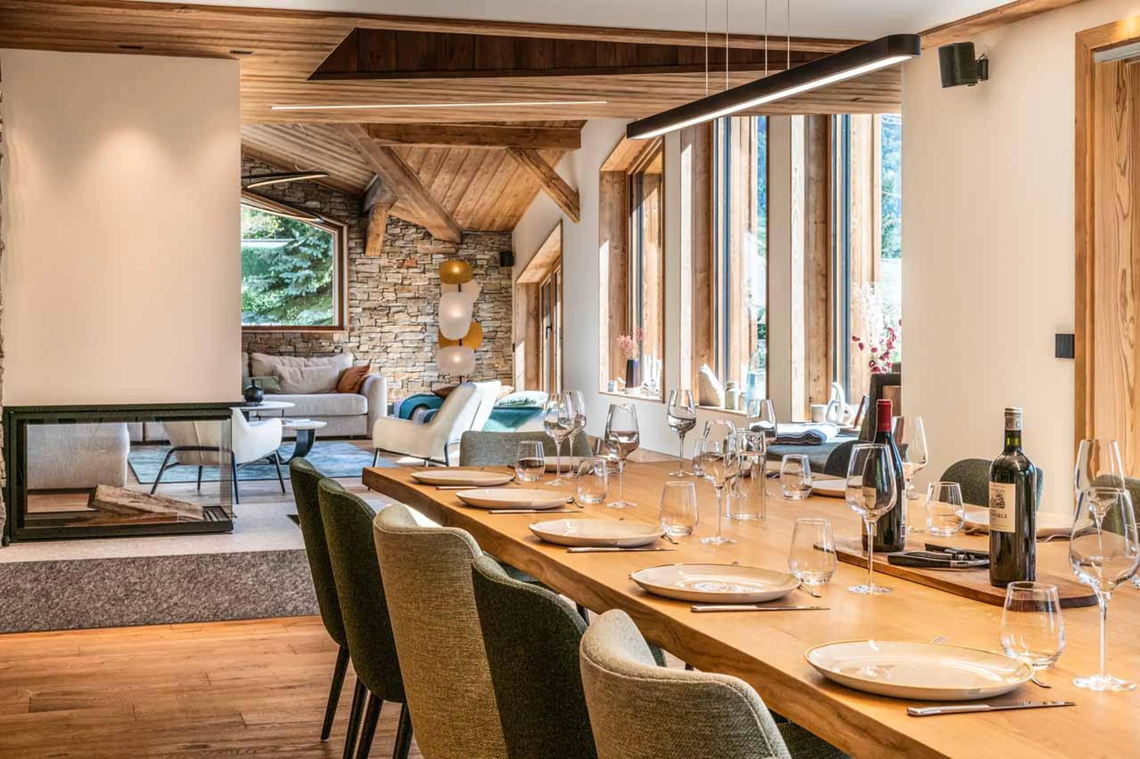 The dining and living area lie adjacent to each other at Granite Mountain Lodge in Chamonix