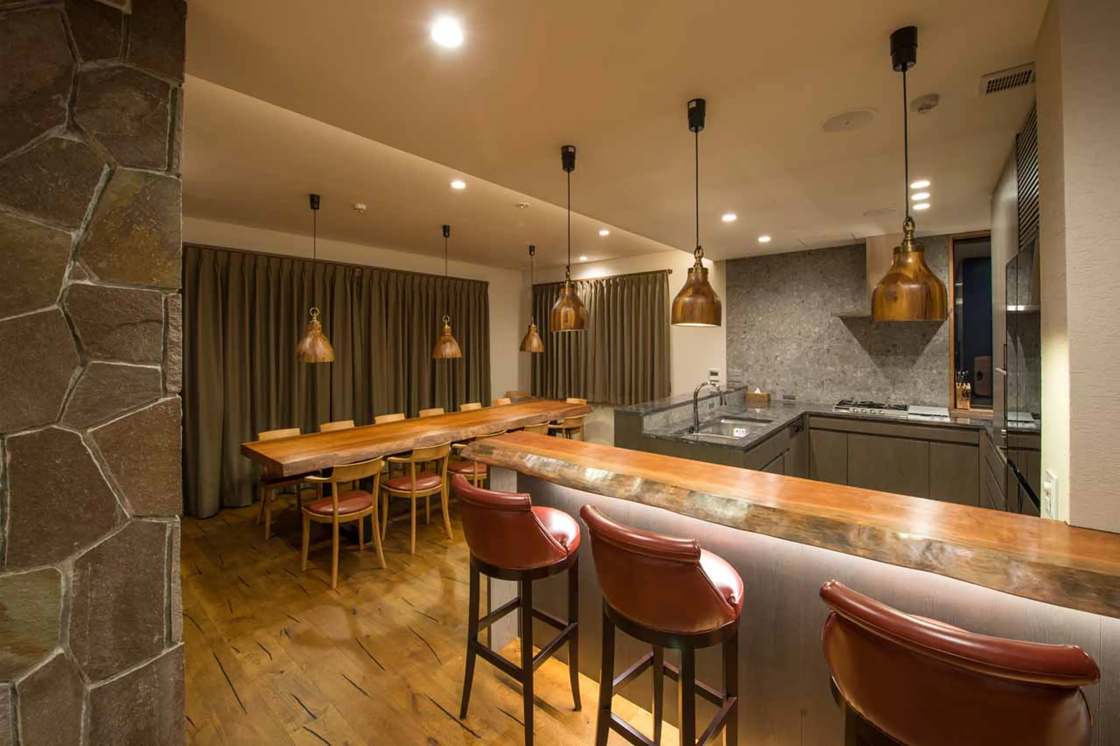 Dining room and kitchen area at Hakuchozan in Niseko