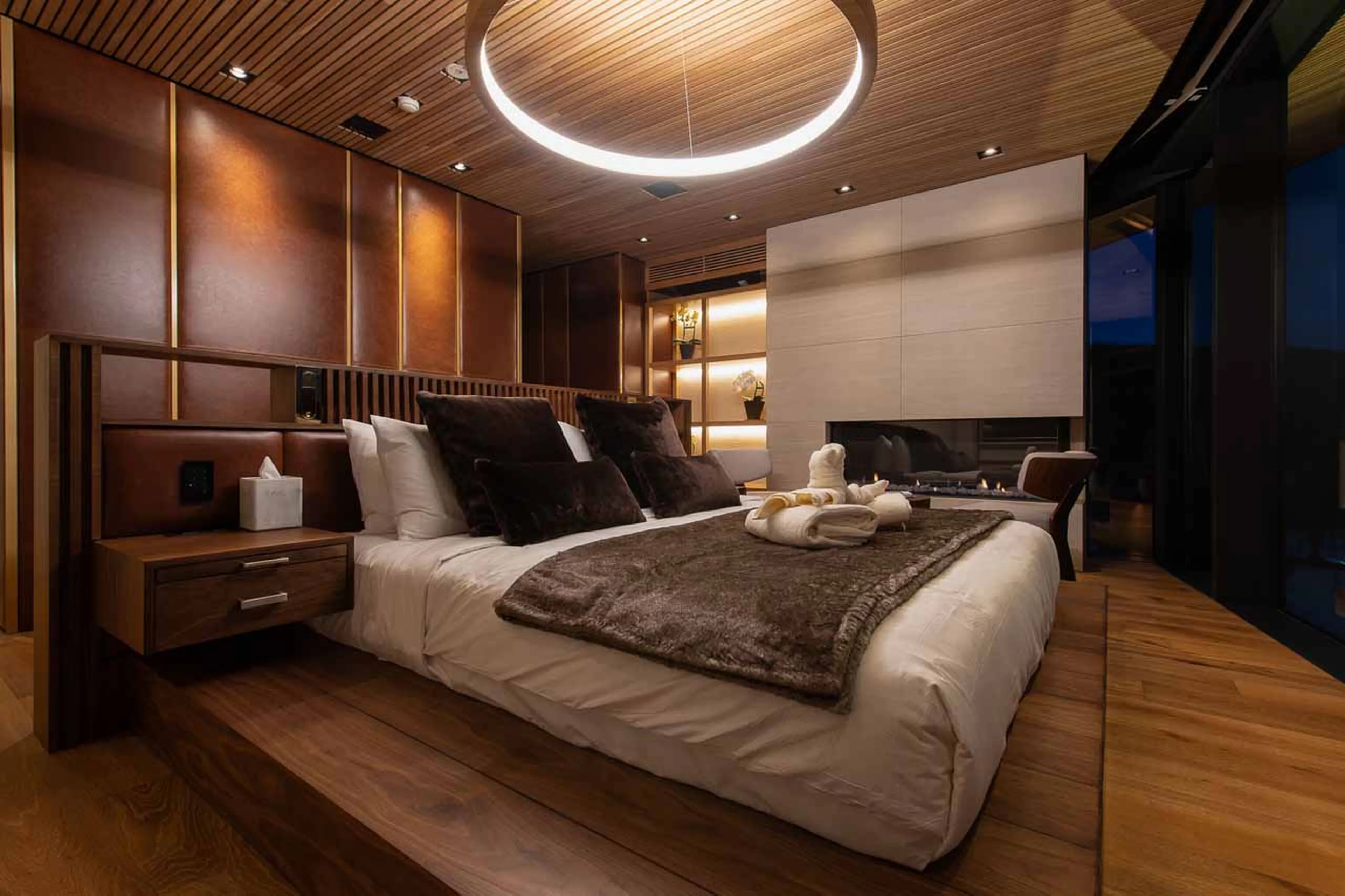 Bedroom at night at HakuVillas Penthouse in Niseko