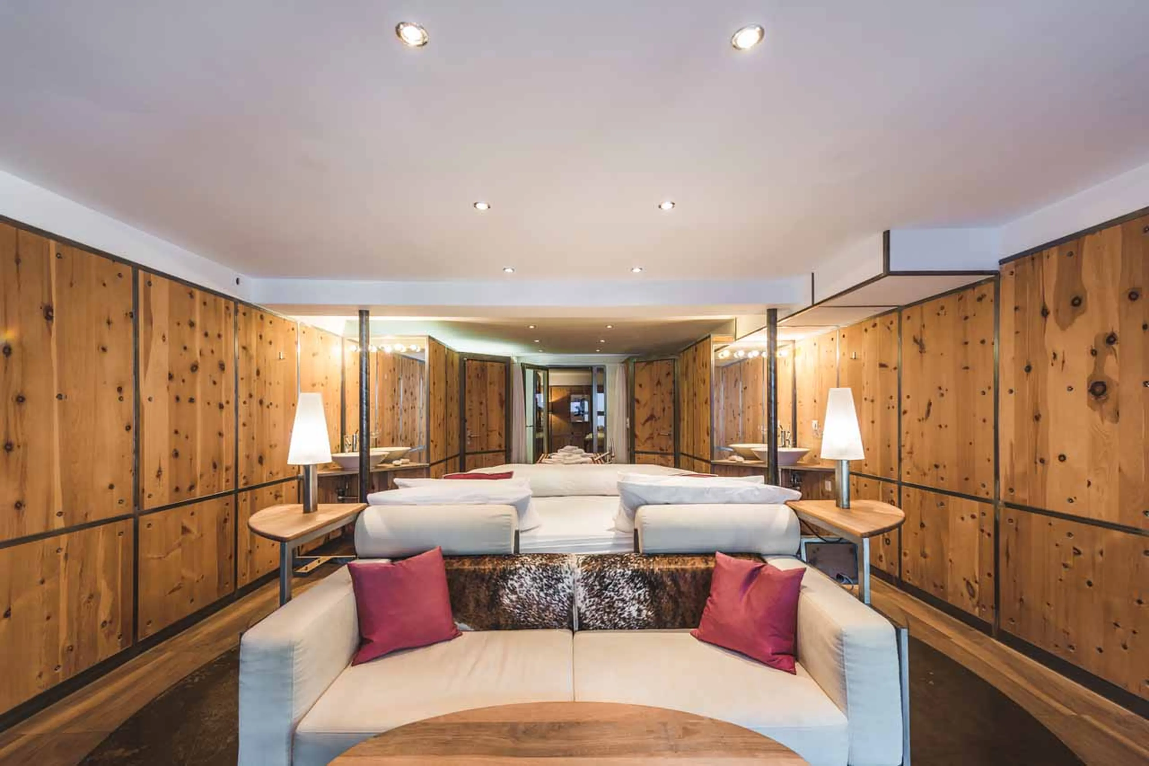 Sofa in master bedroom at Heinz Julen Loft in Zermatt