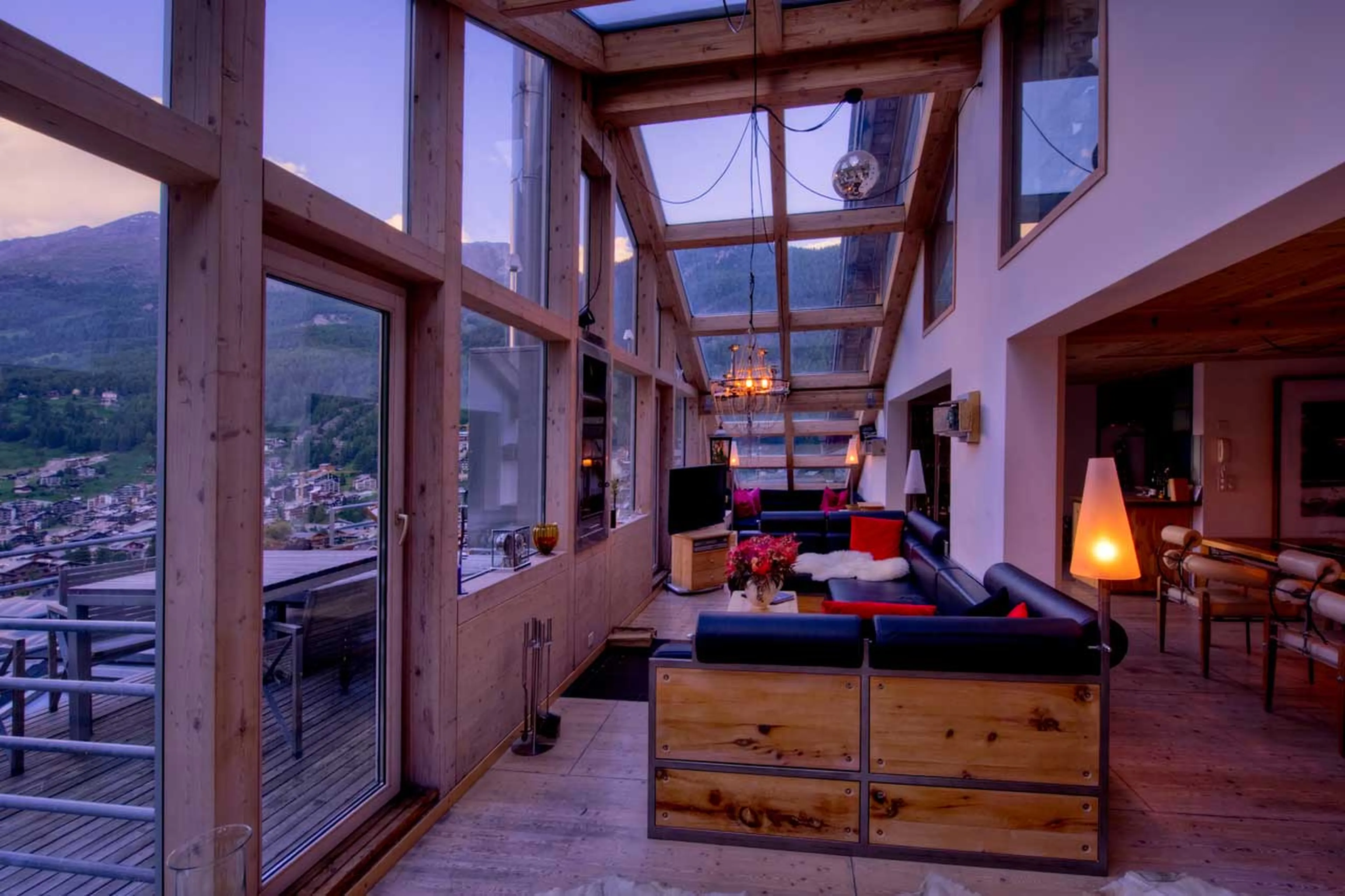 Living area at dusk in Heinz Julen Penthouse in Zermatt