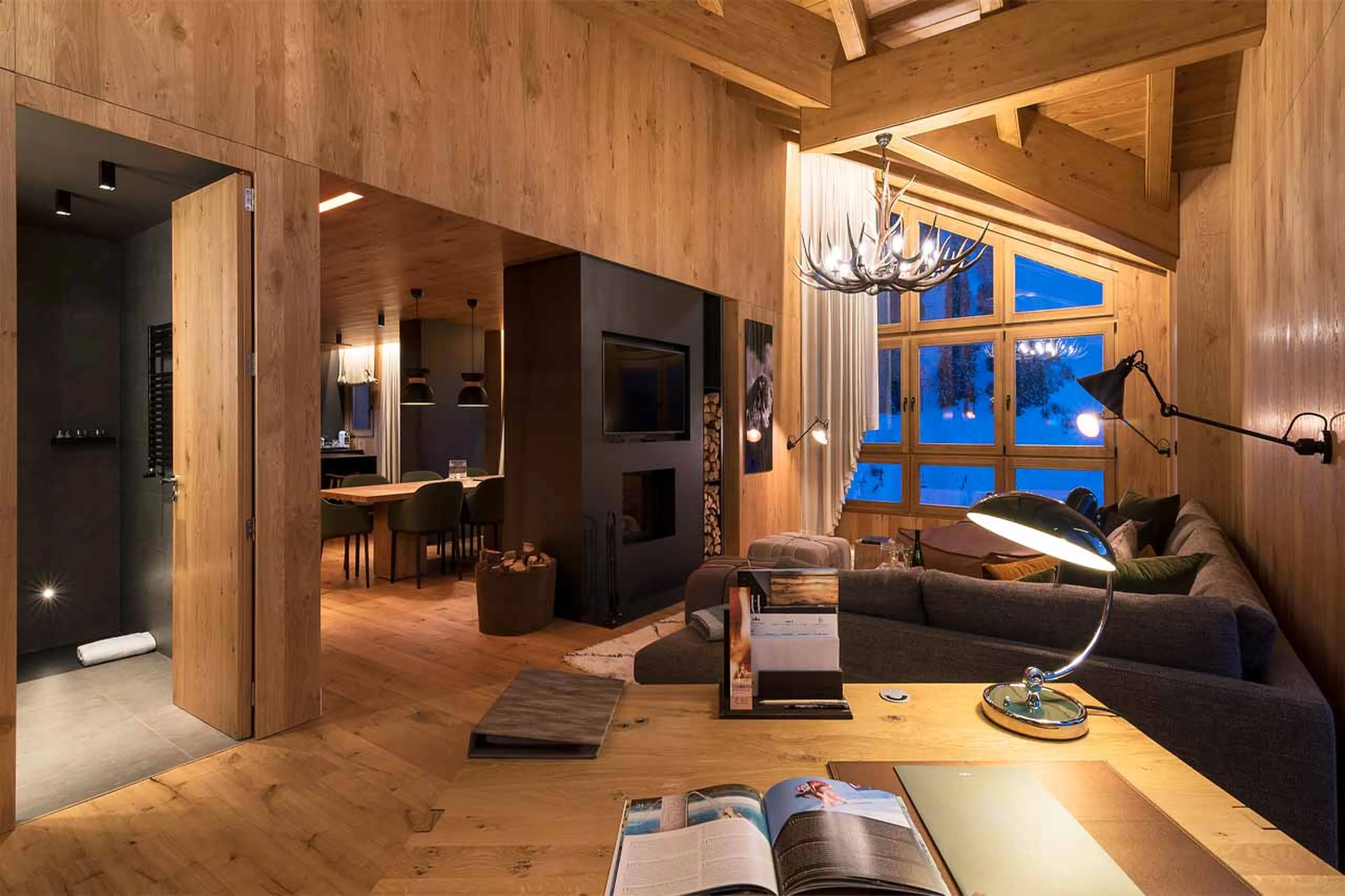 Lounge with two-sided fireplace at Hermitage Mountain Residence 250 in Soleu