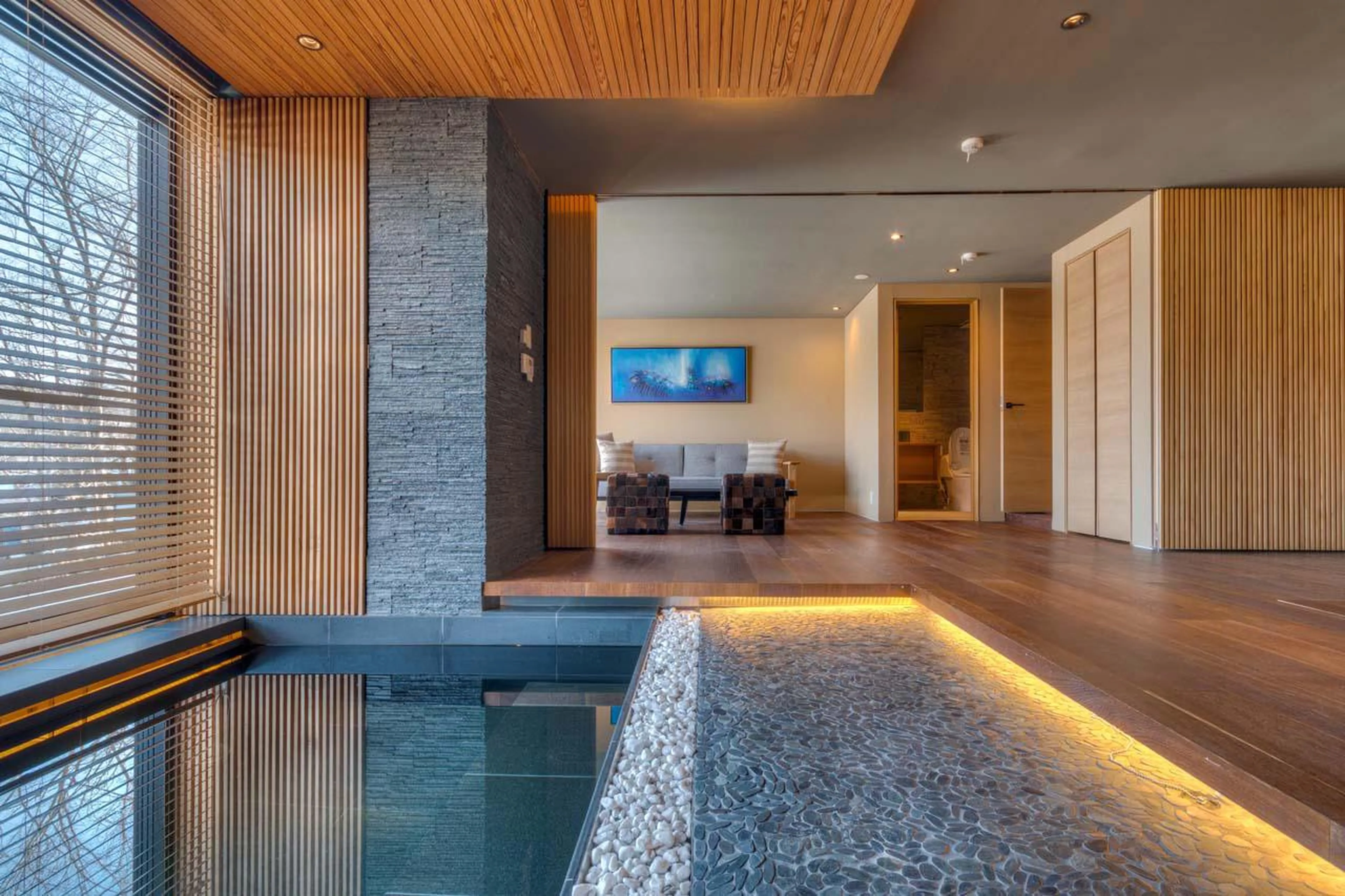 Jacuzzi within open-plan living area at Hideaway on Escarpment in Niseko