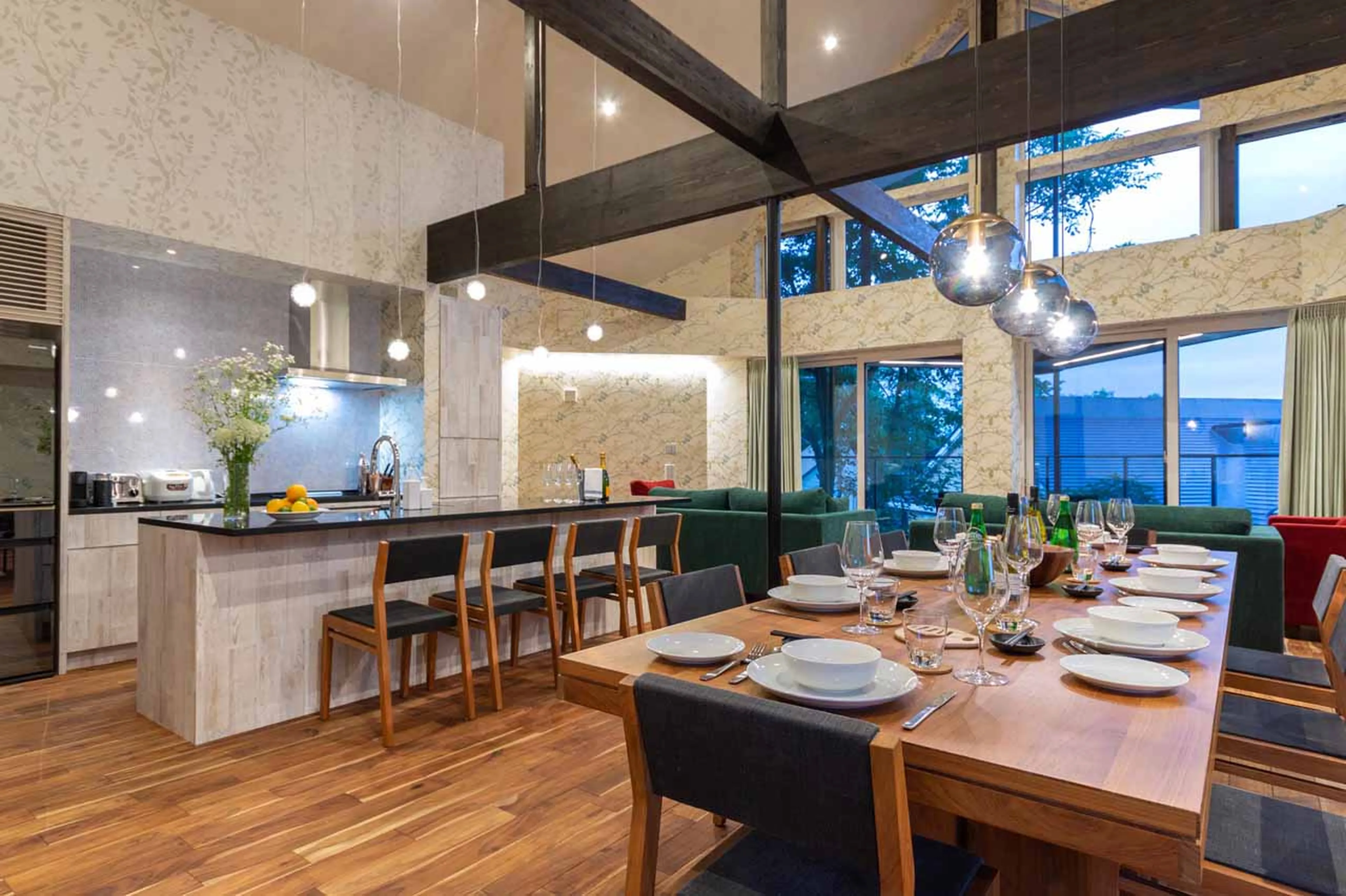 Dining table and kitchen at Kitsune House in Niseko
