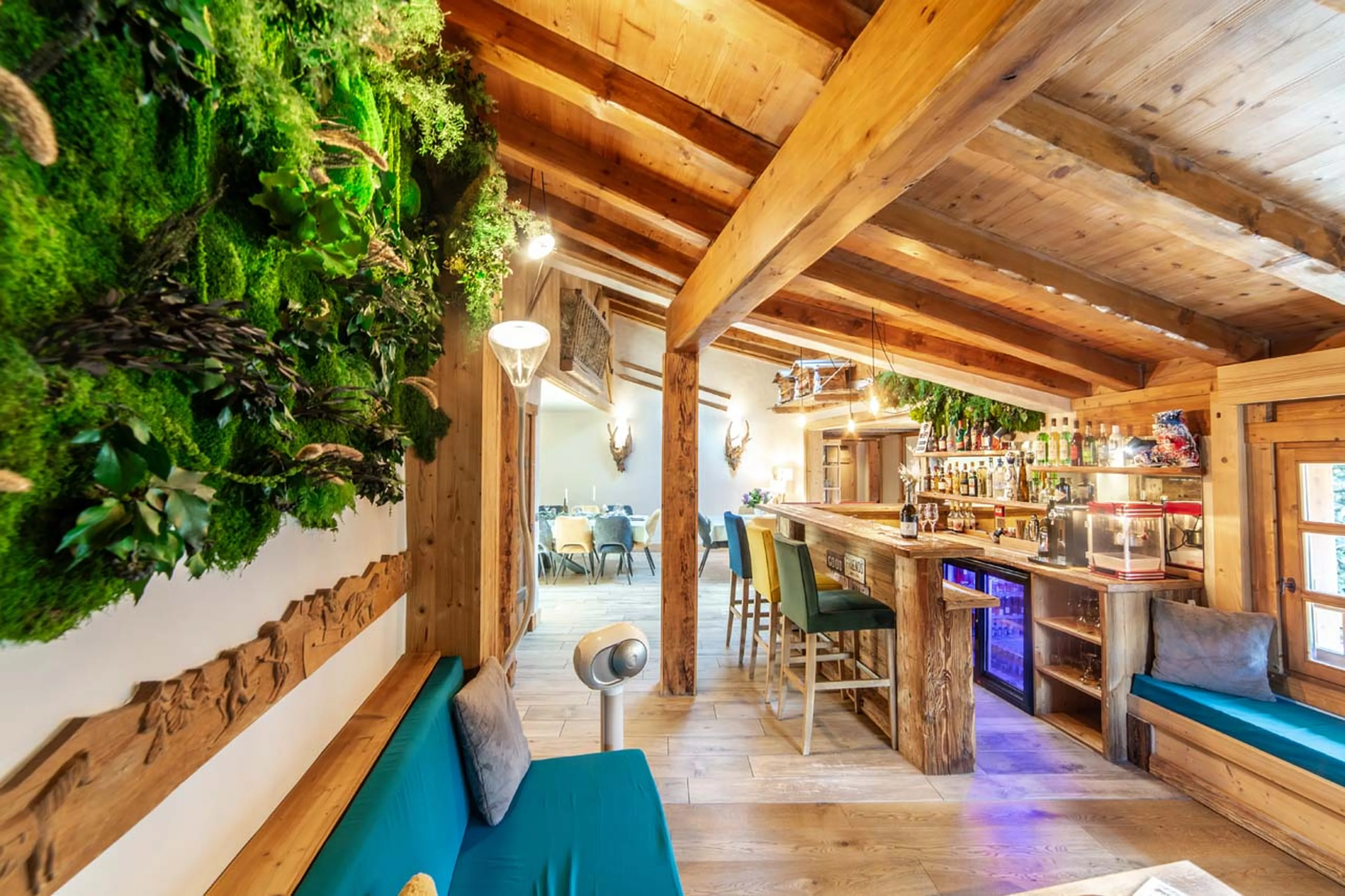 Open plan living area with bar at La Ferme de Mon Grand Pere in Meribel