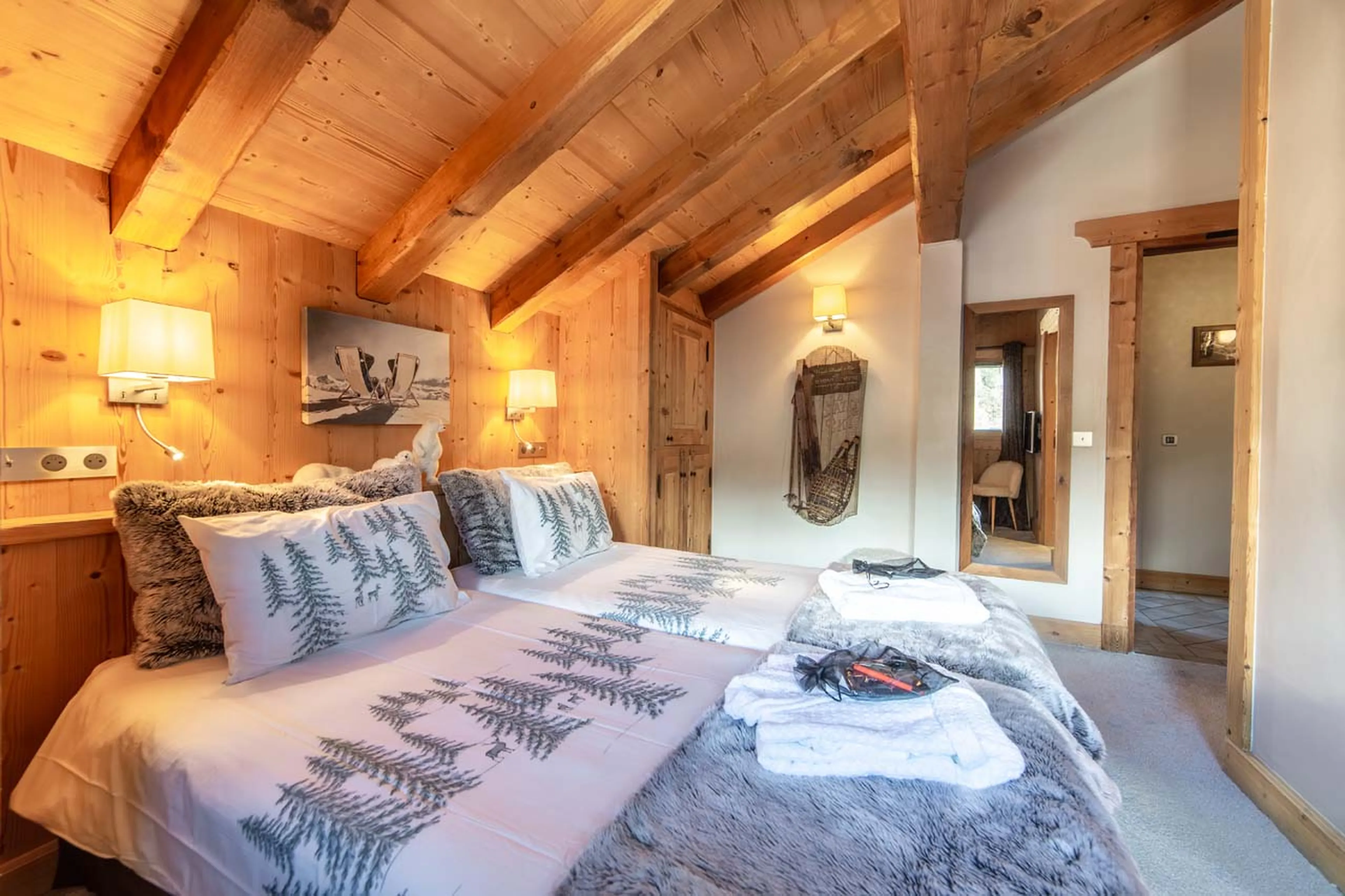 Double bedroom with mirror at La Ferme de Mon Grand Pere in Meribel