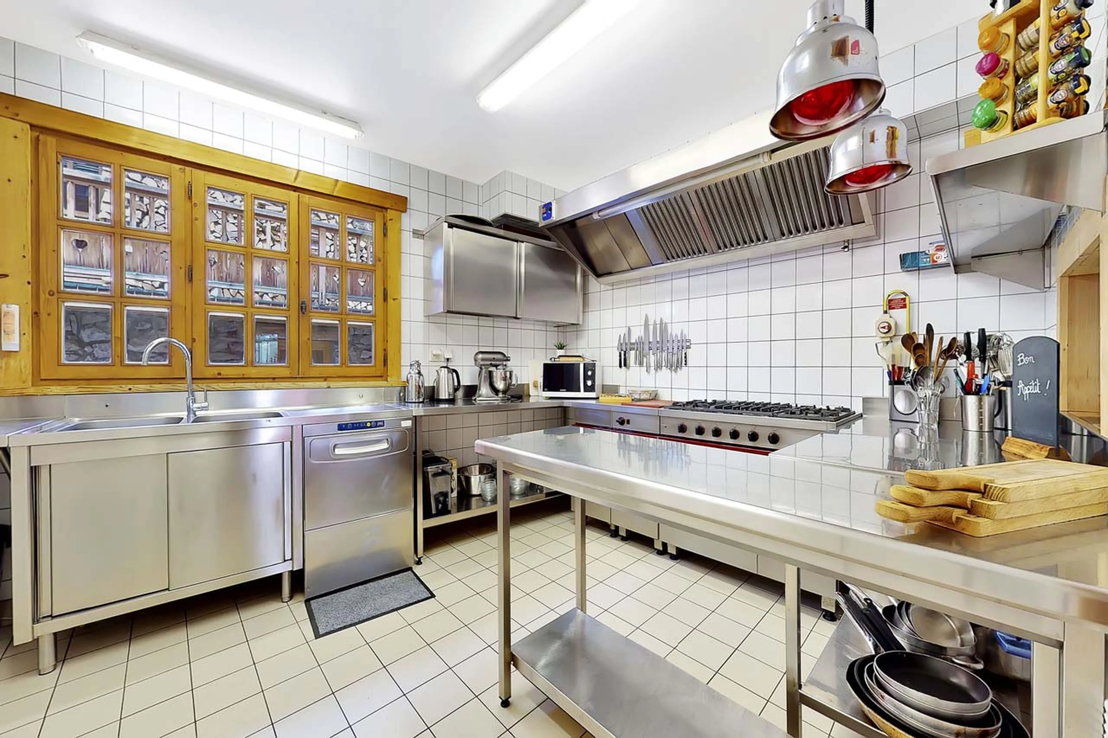Professional kitchen at La Ferme de Mon Grand Pere in Meribel