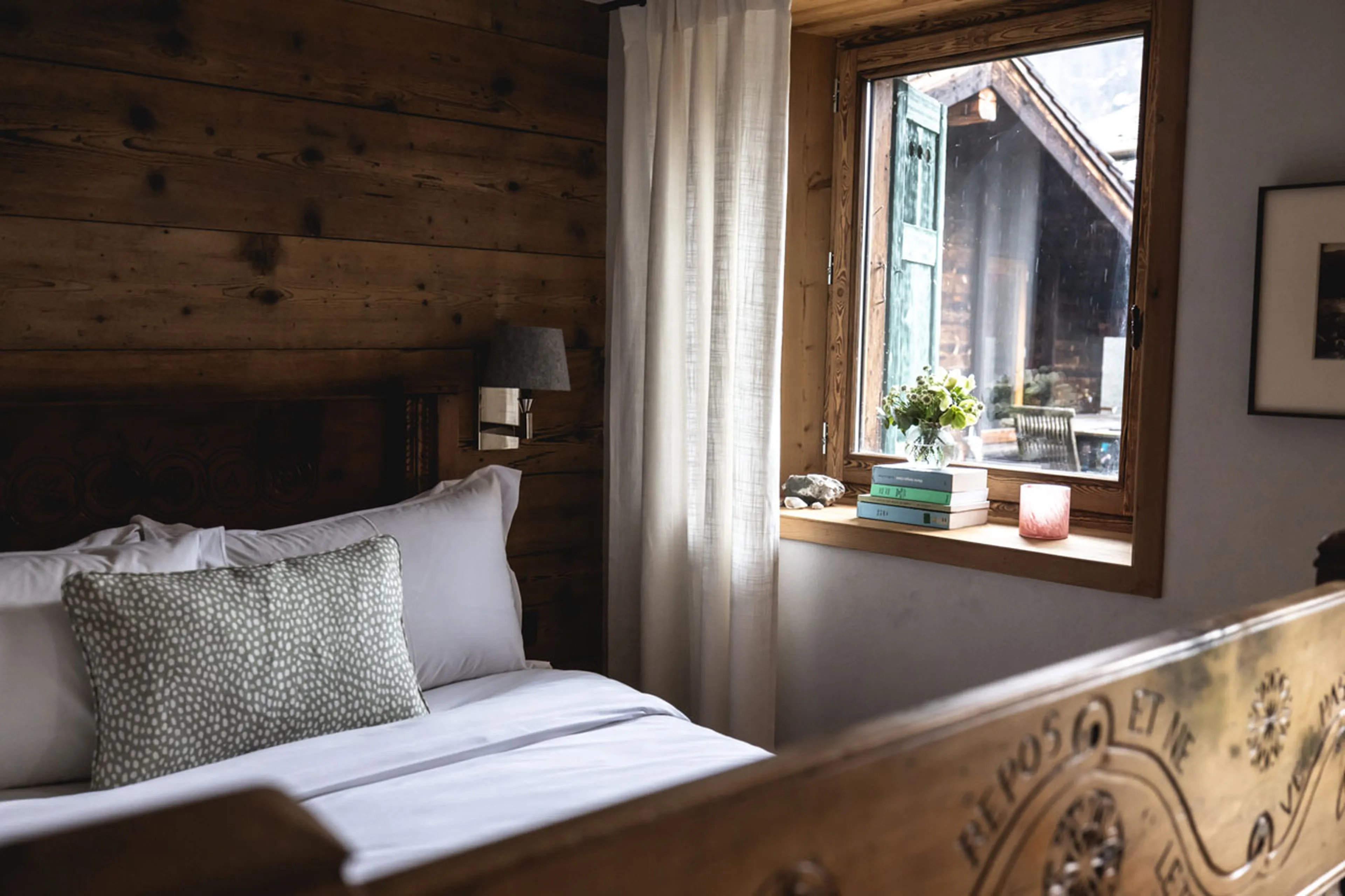 Double bedroom with window in La Ferme des Frasserands, Chamonix