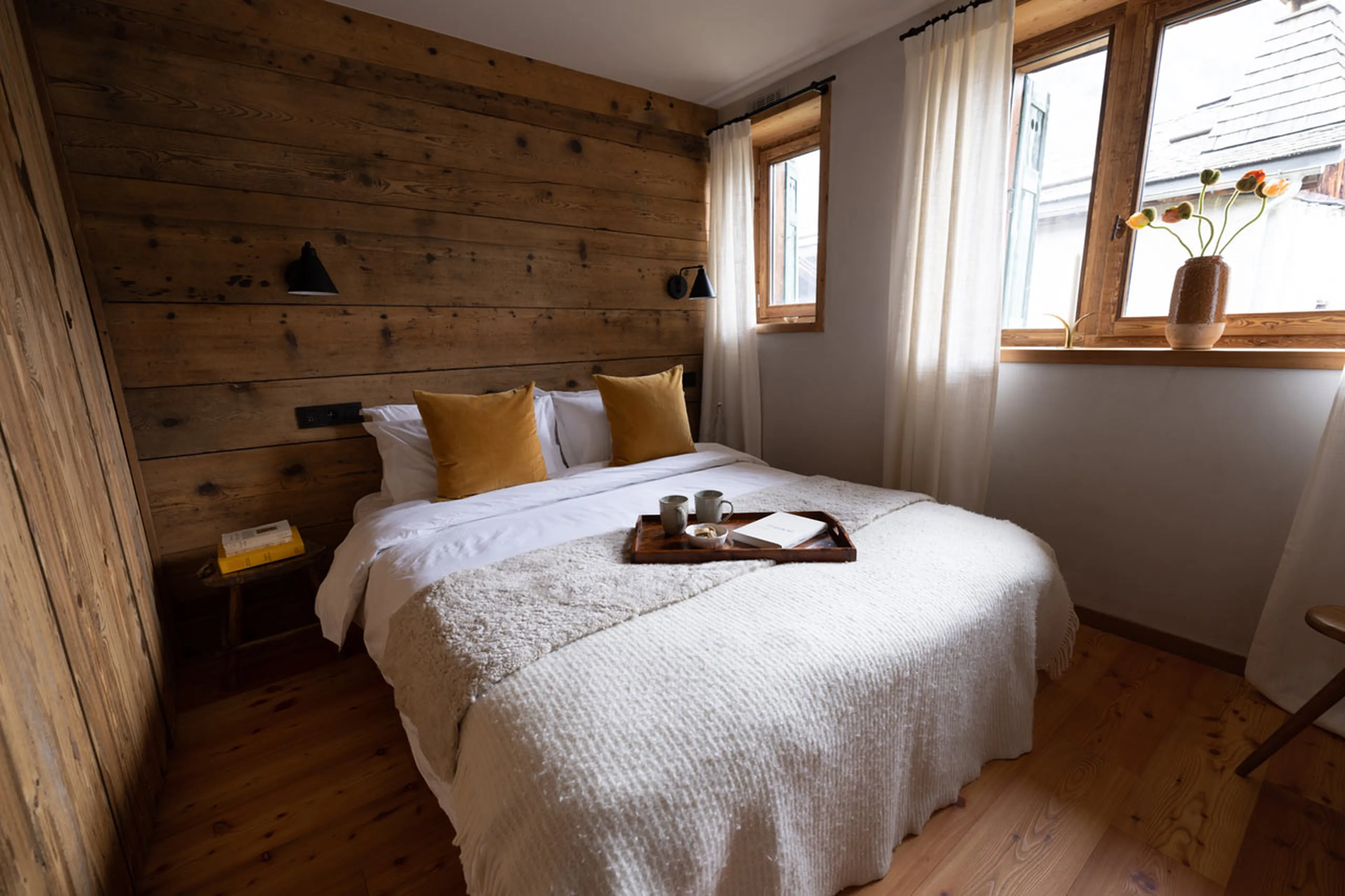 Double bedroom with window in La Ferme des Frasserands, Chamonix