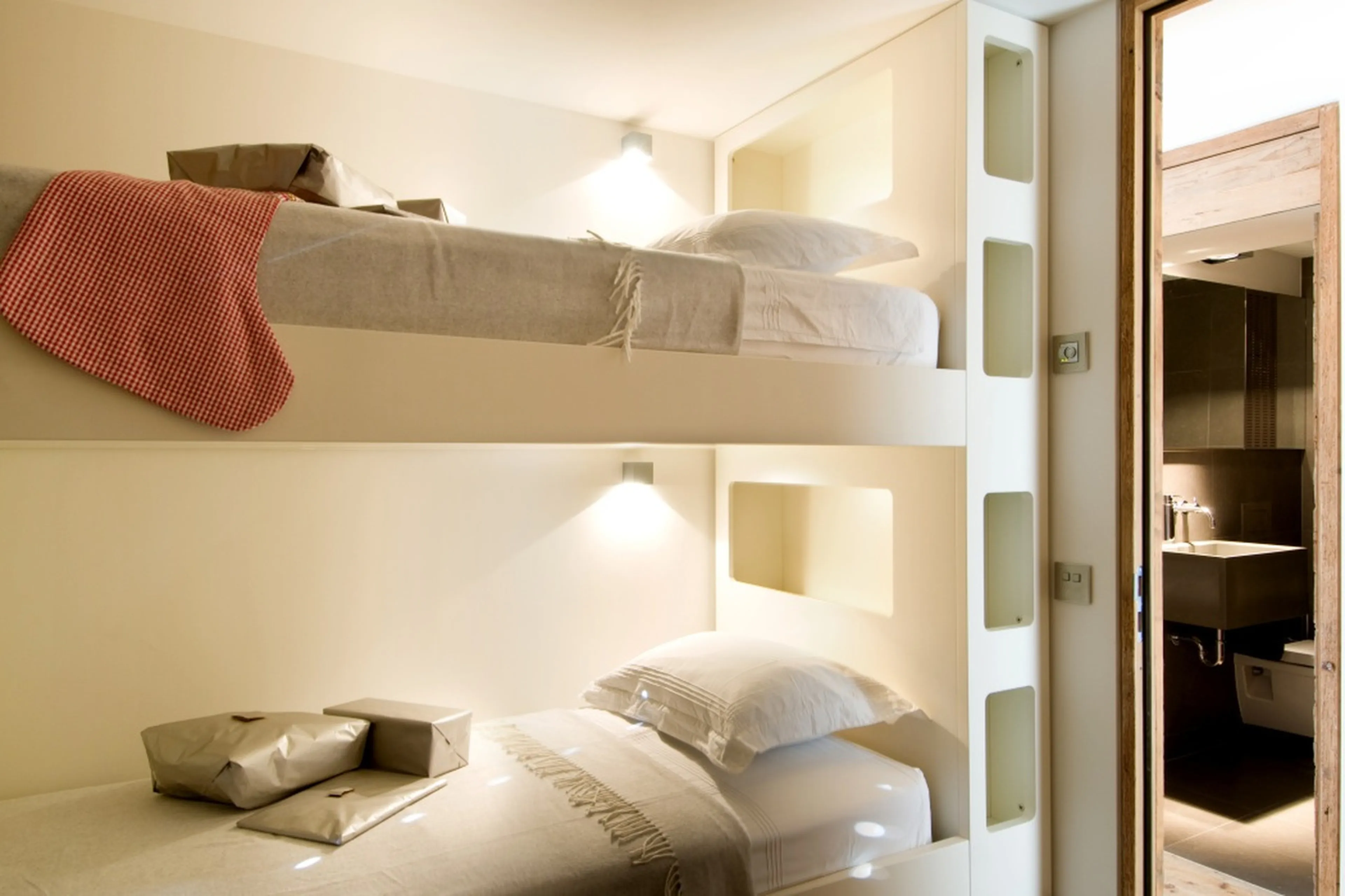 Bunk bedroom with shower room across the hallway.