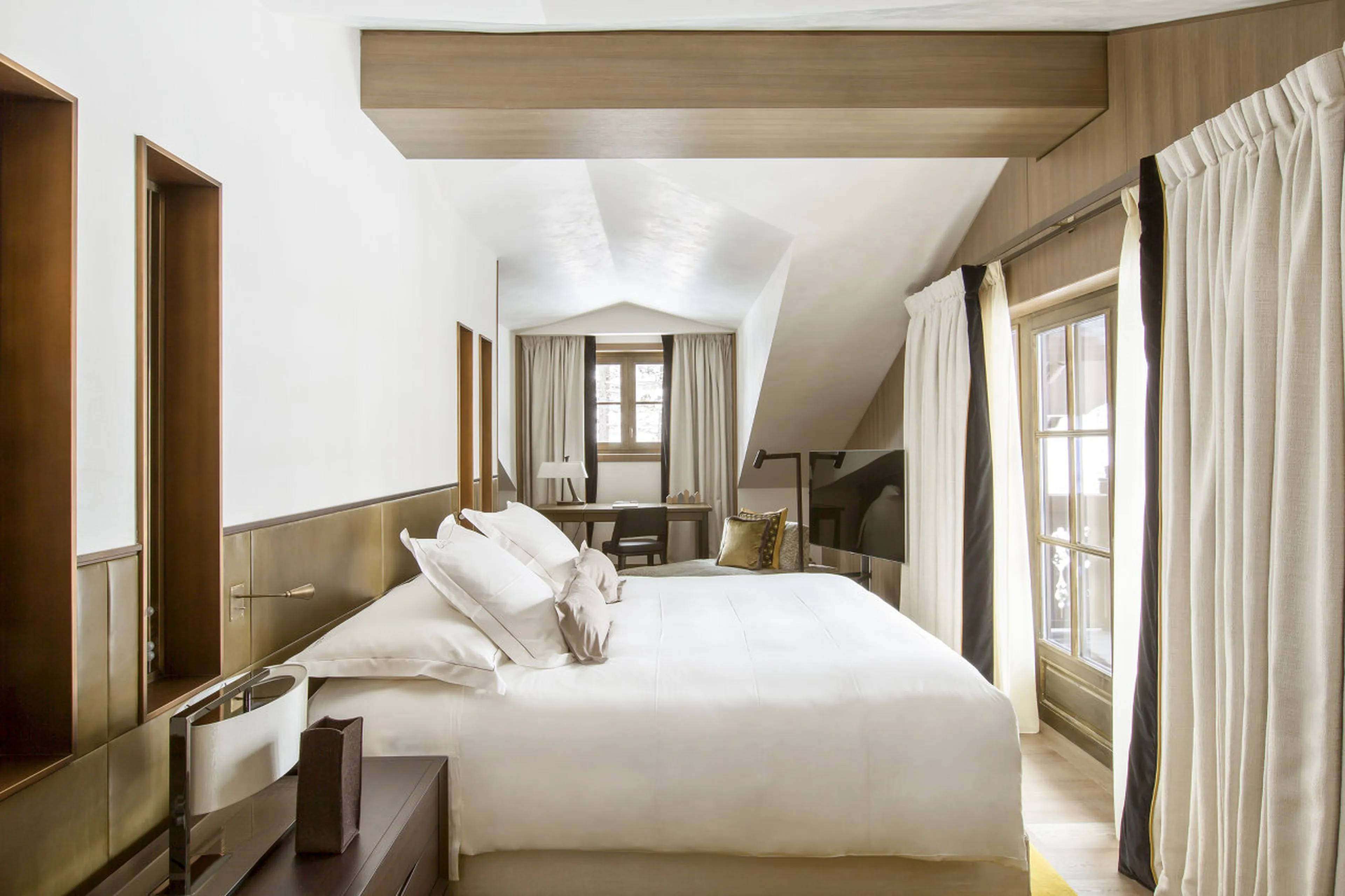 Master suite with king size bed and dressing area in Le Chalet Cheval Blanc, Courchevel 1850