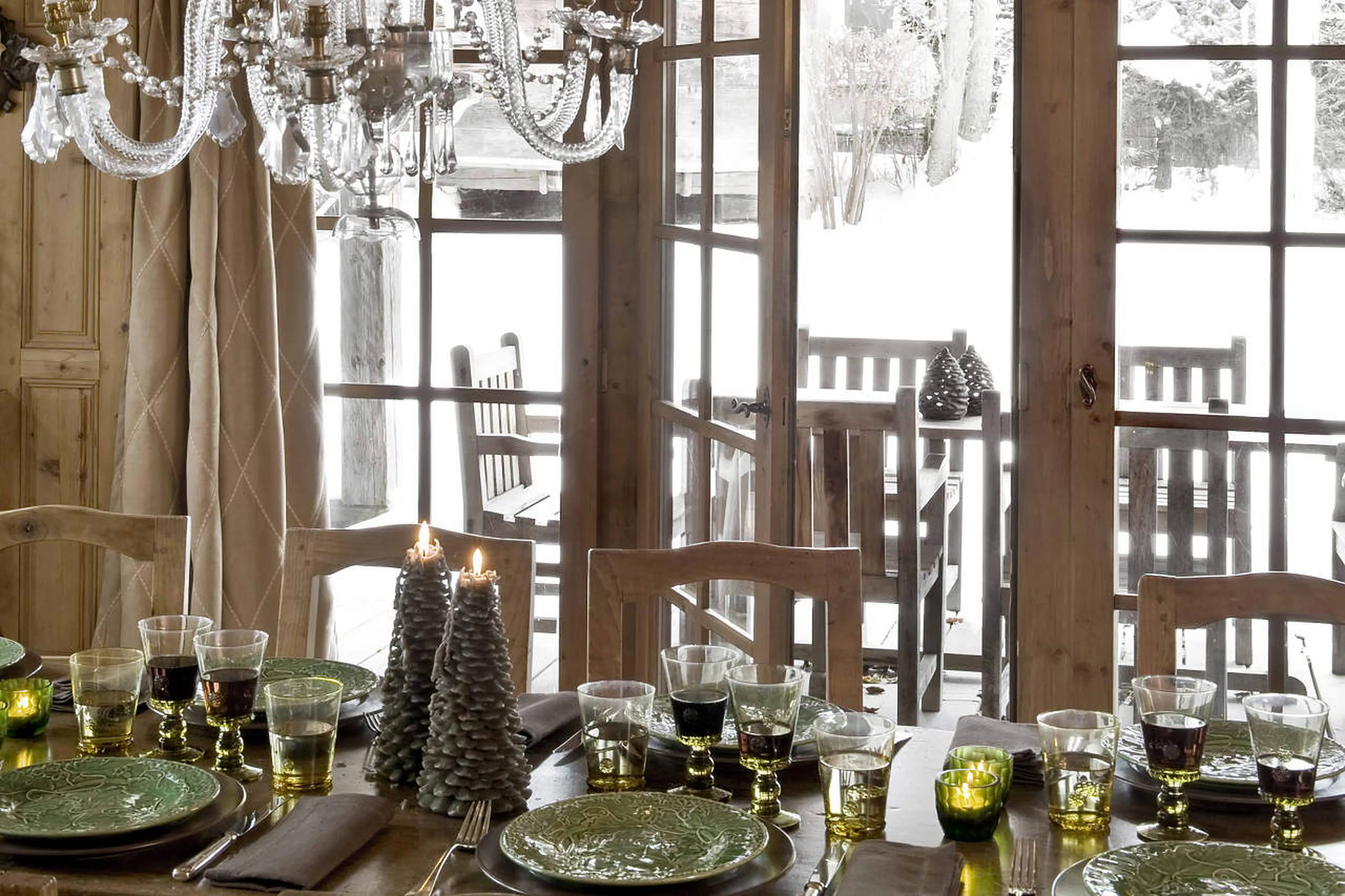 Dining table with view on terrace in Chalet des Fermes in Megeve