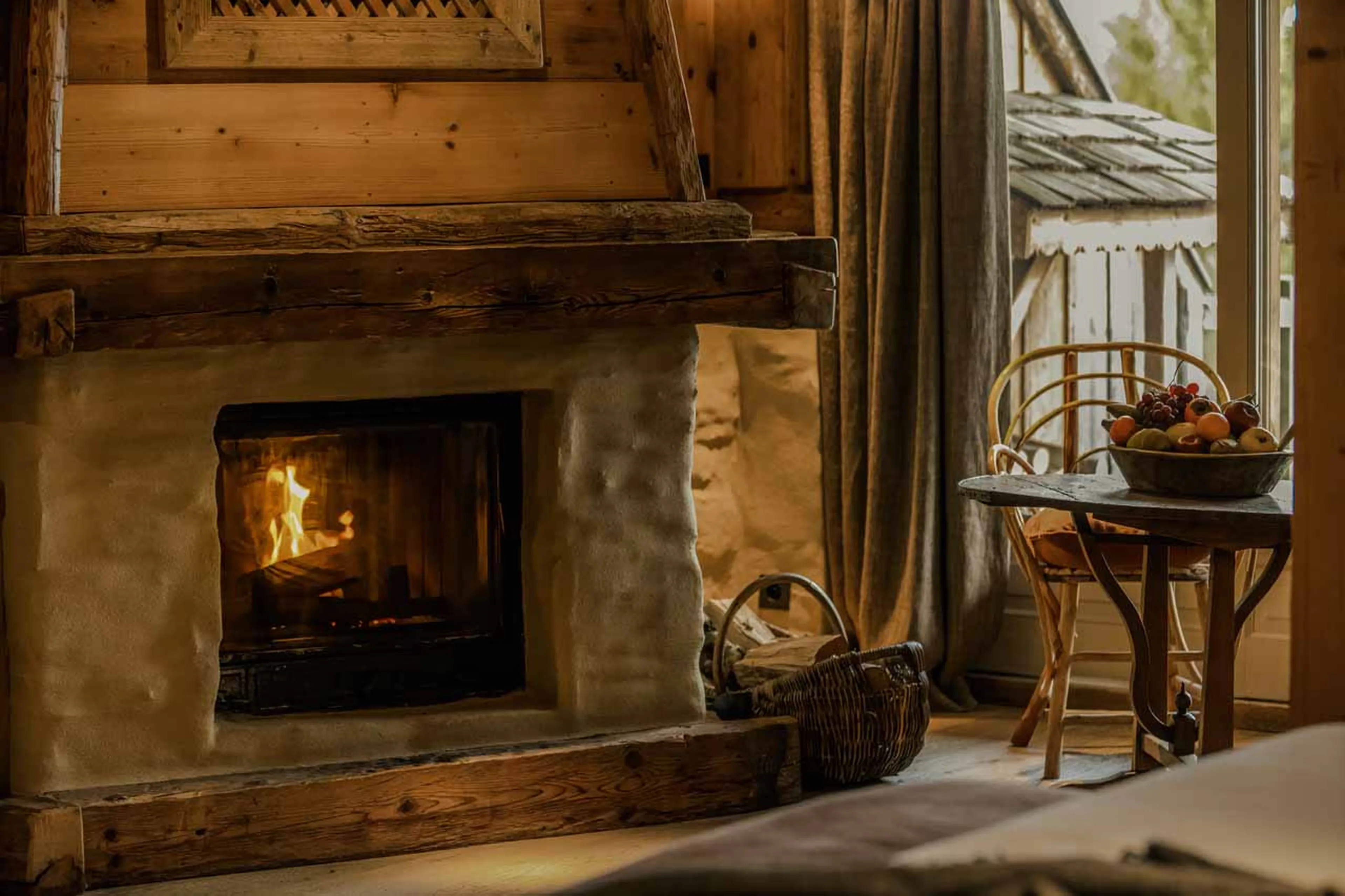 Fireplace in junior suite a Junior Suite relaxation area in Le Chalet Zannier in Megeve