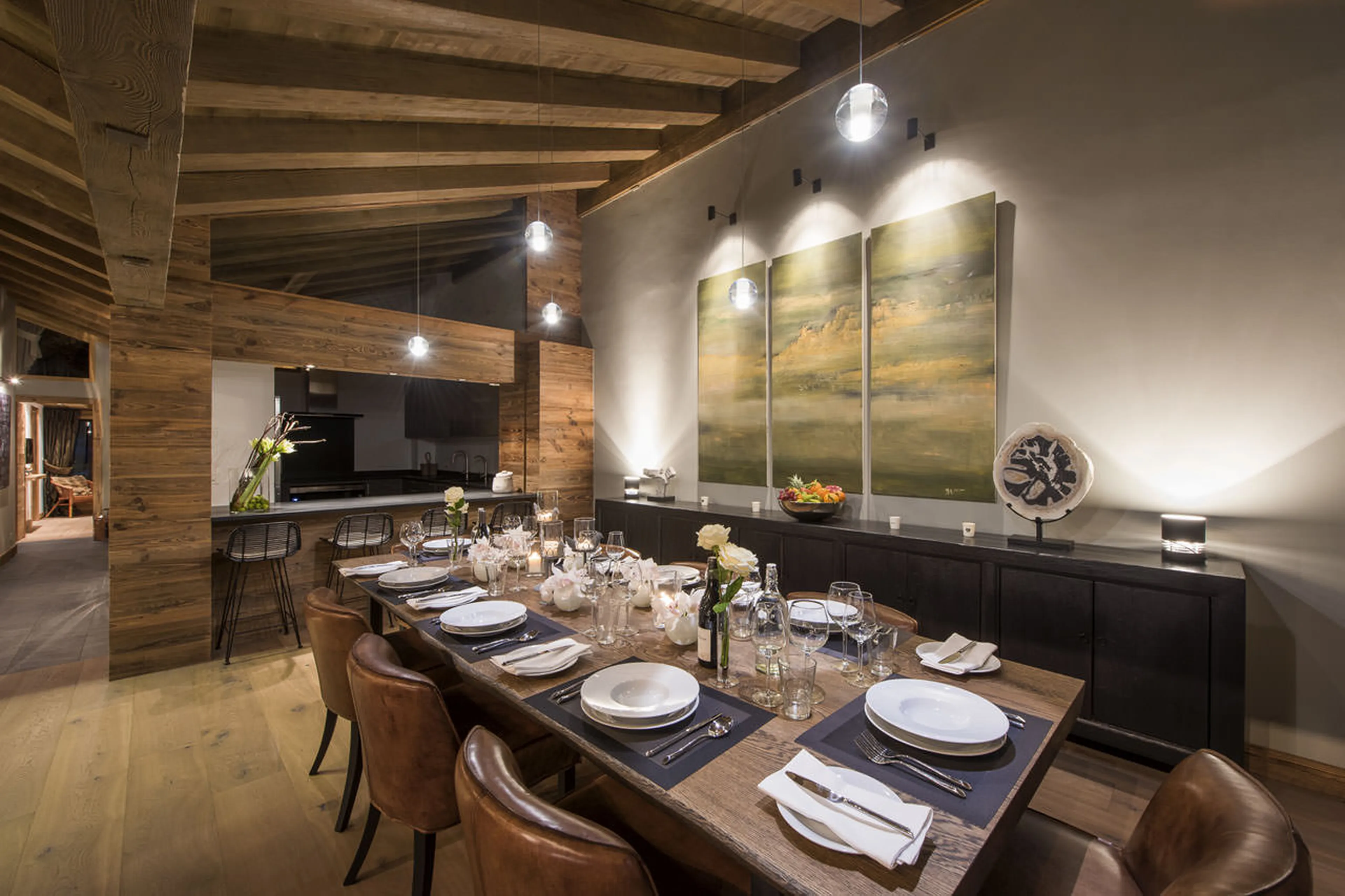 Dining table and kitchen in Le Daray Penthouse in Verbier
