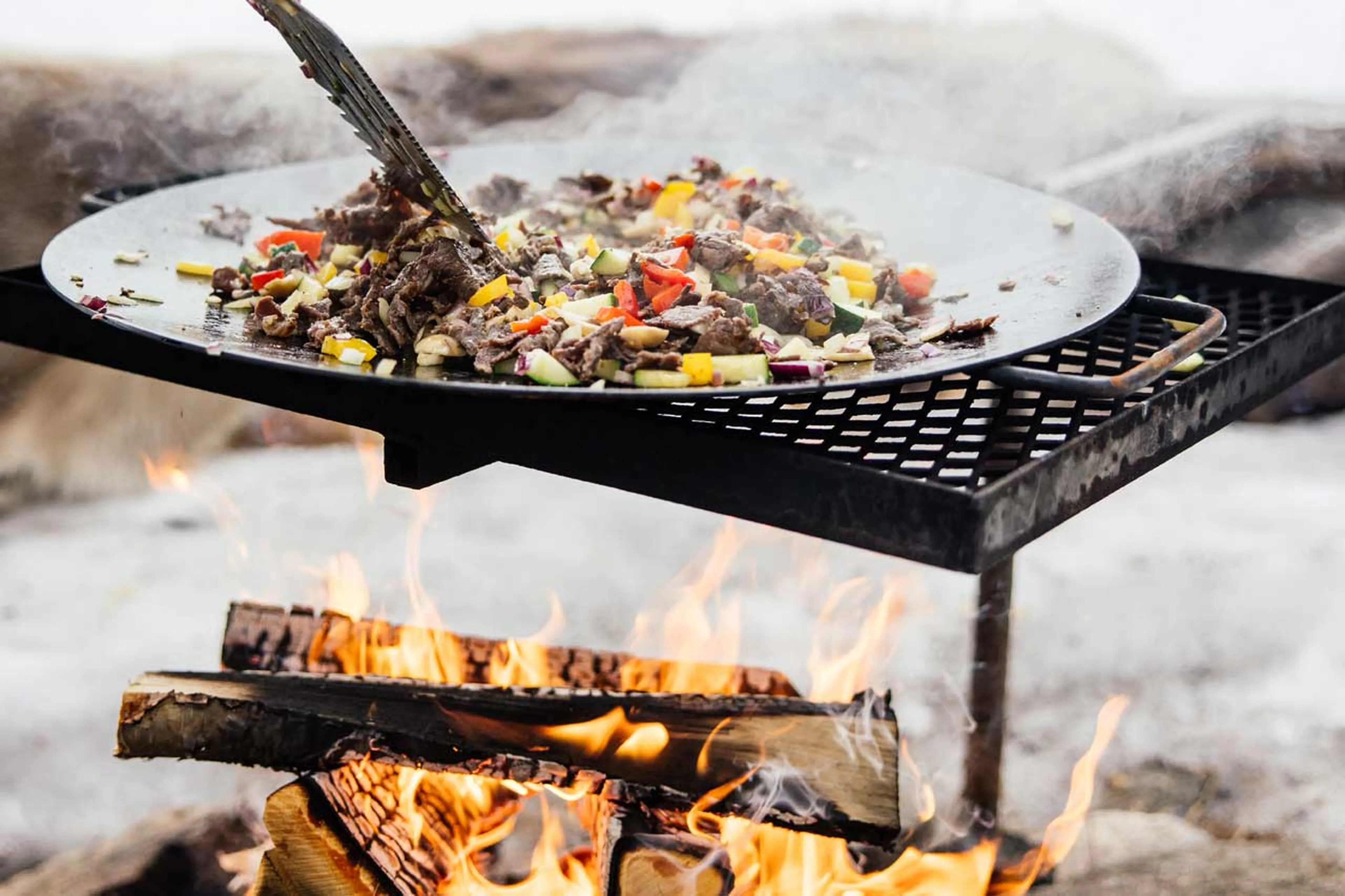 Cooking over open fire at Logger's Lodge in Sweden